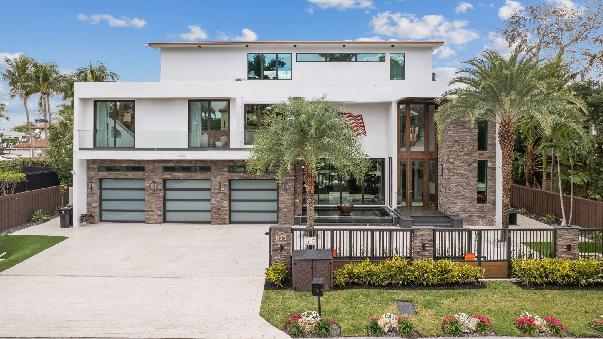*UNBELIEVABLE DEAL - PRICED BELOW APPRAISED VALUE (7/19/25)*   Offered at $7,950,000.
  This ultra-modern, waterfront estate offers breathtaking 360-degree rooftop views of the New River, Sandbar Park and Fort Lauderdale's beautiful skyline.  The 6,464 sq. ft. home sits on a 10,500 sq. ft. lot with 100 feet of deepwater dock frontage next to the point lot, and provides direct access to the New River and Intracoastal Waterway - perfect for large boats and up to 90 ft. yachts. The expansive rooftop terrace is an unparalleled private sanctuary for relaxation, entertainment, working out and enjoying the sunrises and sunsets.  This home is strategically located in the heart of East Fort Lauderdale just one mile from the beach. *SEE ADDITIONAL REMAR Key Features of the Property:
" 100 foot deepwater dock and seawall suitable for up to 90 foot yachts and large boats.
" Home is one lot from the point lot which provides direct access to the New River, Sandbar Park and the Intracoastal Waterway.
" 3rd Floor Rooftop Terrace with 360° Views of Fort Lauderdale including the New River and Sandbar Park.
" Six Bedrooms, Seven full and Two half Bathrooms spanning all 3 floors of the home.
" Private Fitness Room on the 3rd Floor complete with a Himalayan salt wall sauna and fitness equipment.
" Private bedroom and en-suite on the 3rd Floor adjacent to the fitness room, along with a full mini-kitchen.
" 2nd Floor contains the main bedroom, main guest bedroom and 2 additional guest rooms all with private custom bathrooms.
" Main bedroom contains two separate private full bathrooms.
" Custom temperature-controlled wine room on main floor next to dining room.
" State-of-the-Art Kitchen featuring Wolf and Sub-Zero appliances and custom designer cabinetry.
" Kitchen contains an eat-in dining area (separate from the dining room) and a lounge area.
" Smart Home Technology which controls all lighting, temperature, audio and security features.
" Custom enclosed, air-conditioned room on patio perfect for entertaining and hosting cigar nights with built-in smoke removers.
" Custom elevator servicing all 3 floors of the home.
" Main floor contains a full bedroom with private bathroom as well as two half bathrooms and laundry/mud room.
" Air-Conditioned 3-Car Garage with a custom vehicle lift in the middle bay.
" Automated, motorized custom gate at street level providing privacy and security for the property.
" Outdoor patio summer kitchen next to an amazing pool and lounge area.
" Custom outdoor deck surfacing and dock lighting between the patio and seawall.
" Newer 100 foot seawall with a floating dock and safety ramp.
" Custom finishes and wood throughout the home.