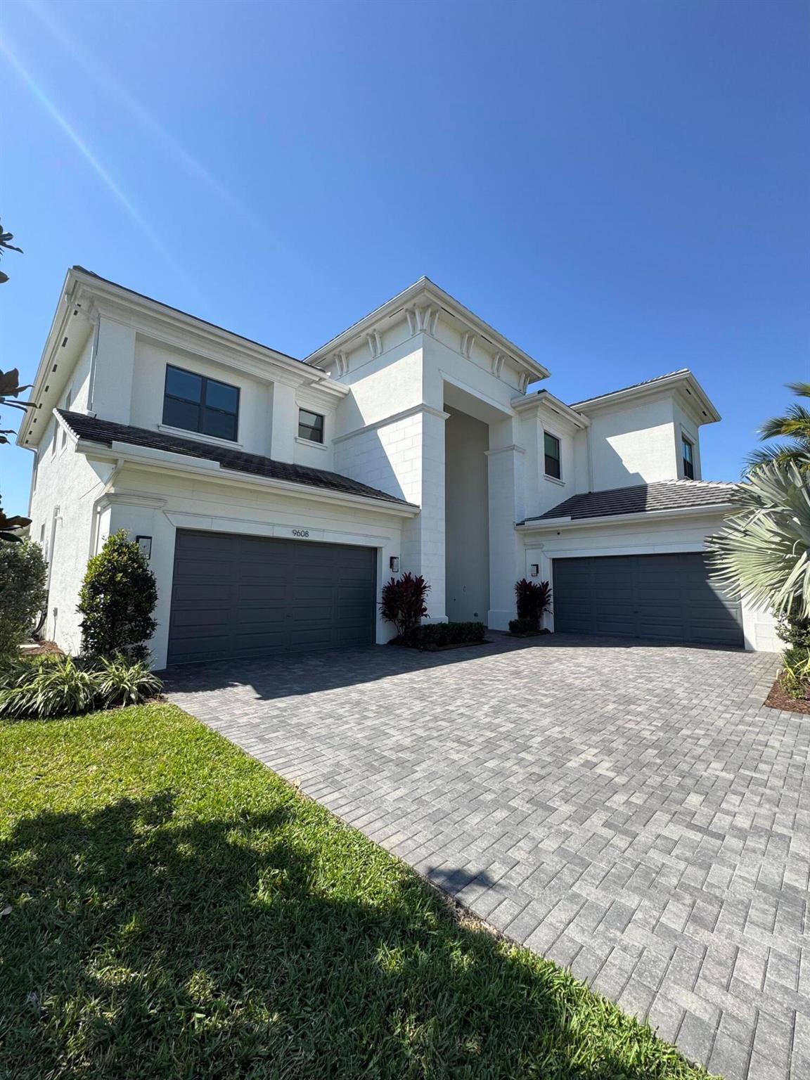 Welcome to this stunning Riverside Model, a true masterpiece of design and elegance, offering 5,800 square feet of meticulously crafted living space. This exquisite residence features five spacious bedrooms with six and a half bathrooms, perfectly balancing comfort and luxury. The interior showcases high end finishes and thoughtful design, highlighted by an open-concept floor plan that seamlessly connects living spaces for effortless entertaining and everyday living. The gourmet chefs kitchen is equipped with top-of-the-line appliances, custom cabinetry, quartz countertops, and an oversized island, combining style and functionality. The opulent primary suite serves as a private sanctuary, complete with a spa like bathroom featuring a soaking tub, dual vanities, and custom walk-in closets. Stepping outside, you'll discover the ultimate outdoor oasis. The custom saltwater pool, enhanced by mesmerizing fire and water features, creates a tranquil ambiance, while the oversized pergola with automated screens offers the perfect space for alfresco dining or simply relaxing by the poolside. Boca Bridges is the premier GL Homes lifestyle community, offering a level of luxury and security that is unmatched. Offering an impressive array of amenities designed for luxurious living and resort-style comfort the state of the art 27,000 SqFt clubhouse features a full service restaurant and lounge, poolside bistro, fitness center with studios offering a variety of classes, his & hers locker rooms with sauna and massage rooms, indoor sports court, card rooms, kids activity center, 7 tennis courts, 4 pickleball courts, multiple pools, kids splash park, outdoor sports court, kids playground, and party pavilion.
