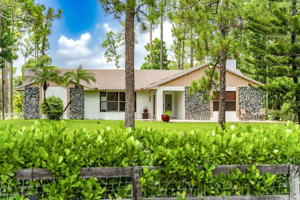 Beautifully Renovated 3BR/2BA + Office on 1.3 Acres - No HOA, Pool, Land & Endless Possibilities Welcome to your private oasis! This stunning fully renovated 3-bedroom, 2-bath home with a dedicated office sits on 1.3 fully fenced acres with no HOA, offering the perfect blend of modern luxury, space, and freedom. Ideal for families, entertaining, or multi-generational living, the spacious split-bedroom floor plan provides comfort and privacy for everyone. Enjoy resort-style outdoor living with a heated saltwater pool, covered patio, and brand-new pavers--perfect for hosting family gatherings and unforgettable celebrations. Inside, the home features fresh paint, new flooring, modern cabinetry, stainless steel appliances, and beautifully updated bathrooms. Newly painted driveway to the garage, new mailbox, and newly built garbage area. Entertain in style with a custom-built, customized bar, cozy fireplace, Big TV included, and luxury pool table--creating the ultimate space for relaxing and hosting guests. Additional highlights include metallic epoxy garage floors, a new reverse osmosis (RO) water system, and a roof under 4 years old for added peace of mind. The expansive property is designed for both lifestyle and functionality, featuring dual gated entrances, 3 storage sheds, dog kennel, chicken coop, and a brand-new well. There is ample space for RVs, boats, trailers, work vehicles, and even horses. Plus, there is room to expand or build additional structures to fit your needs. This rare property offers privacy, land, modern upgrades, and unmatched flexibility--perfect for living, working, entertaining, and enjoying the lifestyle you deserve. New water filtration system recently installed with a 5-year warranty for added value and peace of mind. Don't miss this exceptional opportunity to own your dream home!