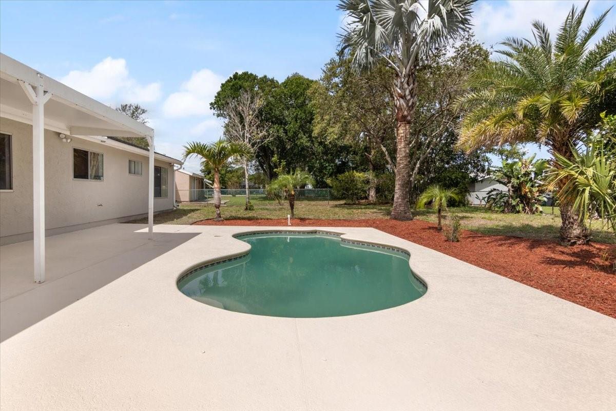 LIGHT AND BRIGHT 3 BEDROOM 2 BATHROOM ONE CAR GARAGE 2724 TOTAL SQ FOOTAGE FENCED POOL HOME WITH OVERSIZED POOL DECK ON 10,454 LOT. HOME FEATURES AMAZING FULLY REMODELED BRAND NEW FLOORING FRESHLY PAINTED INSIDE AND OUT INCLUDING THE DRIVEWAY , POOL DECK AND GARAGE FLOOR. 42 INCH WOOD CABINETS , STAINLESS STEEL APPLIANCES , SS SINK ,RECESSED LIGHTS. BRAND NEW BATHROOM VANITIES , LIGHT FIXTURES & FANS. FULL SIZE SIDE BY SIDE WASHER AND DRYER .BRAND NEW POOL PUMP AND GARAGE DOOR OPENER. WE ARE GLAD TO WORK WITH FHA BUYER. BEAUTIFUL LANDSCAPE AND FRUIT TREES. CONVENIENTLY LOCATED CLOSE TO SCHOOLS, SHOPPING,PARK EASY ACCESS TO I95. HOA INCLUDES USE OF RECREATION CENTER- CLUB HOUSE, POOL. WALKING DISTANCE TO COMMUNITY POOL (only $19/month),SCHOOLS ,GROCERY STORES,PARK,RESTAURANTS, GYM ETC.