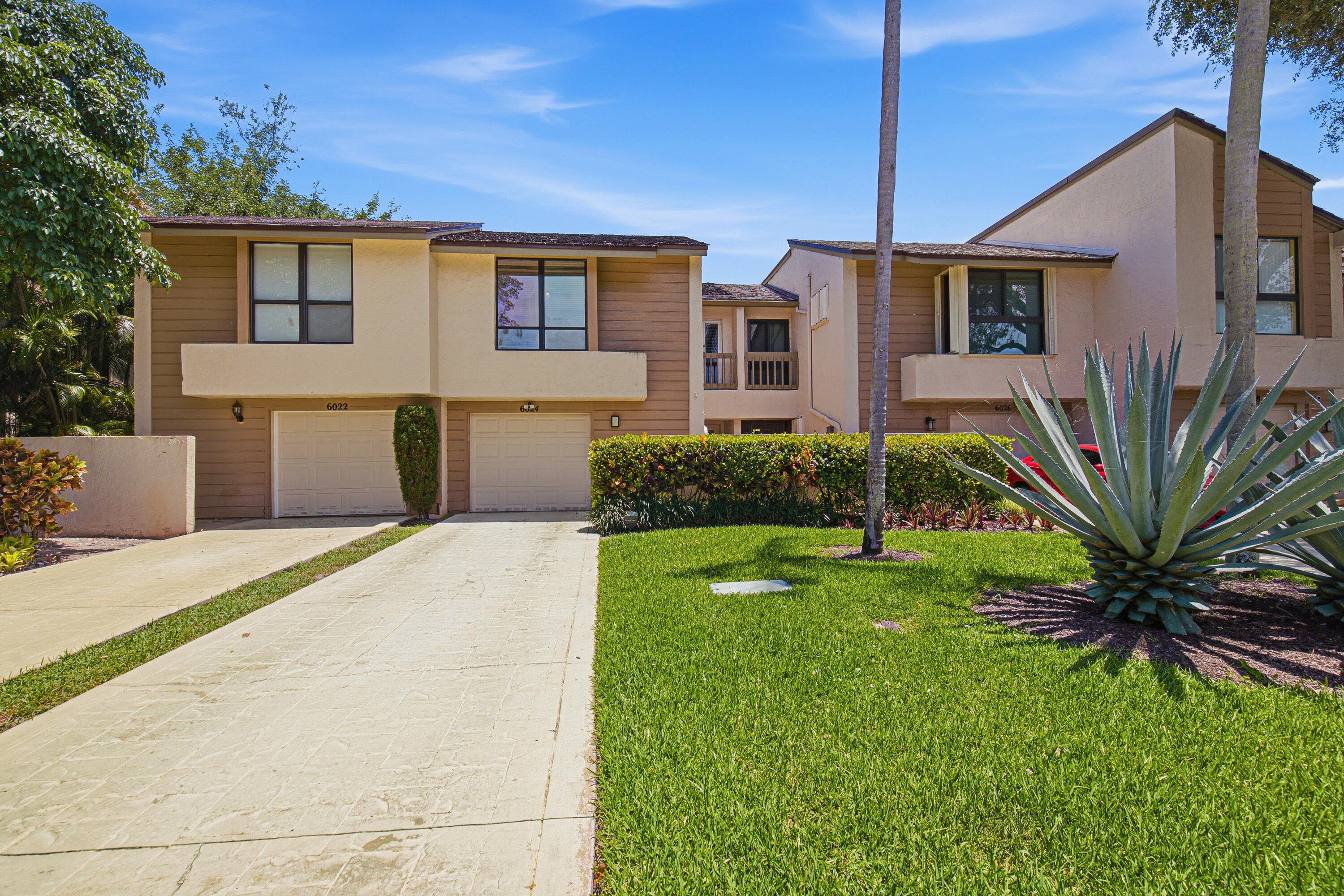 Beautifully maintained 3-bedroom, 2.5-bath townhome with a one-car garage, ideally situated on a private waterfront lot with mature shade trees and tranquil views. Light and bright throughout, this home features soaring ceilings and a custom architectural feel that creates an open, airy ambiance. One of the few homes in the community with a grandfathered two-story screened enclosure—a rare feature no longer permitted—offering exceptional indoor-outdoor living space. The newer roof provides added peace of mind. Just steps from the community pool and within walking distance to restaurants, shopping, and places of worship, this home is perfectly located in the heart of desirable East Boca Raton.  Whether you're looking for a full-time residence or a seasonal retreat, this attractively priced waterfront townhome is a rare opportunity.