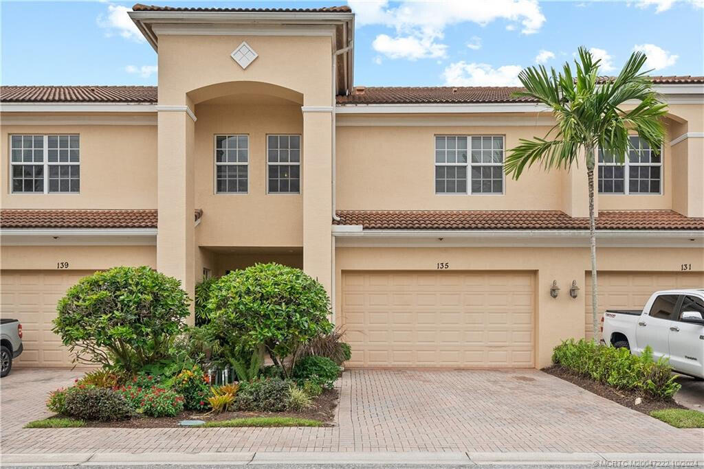 This fabulous townhome in Whitemarsh Reserve features full impact windows, providing added security, energy efficiency, and peace of mind. Offering over 2,100 sq ft of spacious living—comparable to a single-family home—this home is a must-see! The bottom floor boasts high ceilings that create an open, airy feel, with tile throughout. The eat-in kitchen has granite countertops. The great room, dining area, laundry room, covered patio with stunning preserve views, and a two-car garage complete the main level. Upstairs, you'll find a large master suite with a tray ceiling, a generous master bath, and an oversized walk-in closet. Two additional bedrooms, another full bath, and a huge loft area provide ample space for entertaining or a home office. Recent updates include a newer A/C,  water heater, and complete impact windows. Enjoy easy access to I-95, and be close to beaches, shopping, and restaurants. The community offers an unmanned gate, pool, basketball court, and playground area. Don't miss out on this incredible opportunity! More Pics to come.