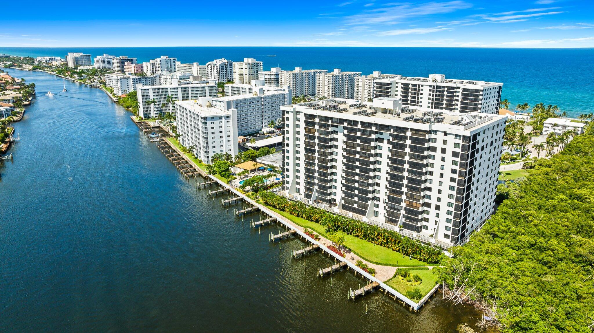 Enjoy breathtaking sunsets and watch boating activities from the comfort of your condo.  A NW corner and split floor plan with spectacular direct intracoastal views from every room!!  This unit has a new AC, new water heater and new kitchen appliances along with impact glass throughout. WELCOME TO LUXURY RESORT STYLE LIVING with two pools & hot tubs, sauna, docks, pickleball, tennis and a well equipped gym with an ocean view.  Residents love the private concierge Ocean Club with beach attendants along with BBQ grills and indoor or outdoor dining over looking the ocean.  Coronado has an active lifestyle and offers many social activities.  The community has a 24 hour manned security gate, fully funded reserves and is current on all inspections.  Concrete restoration and roofs in 2024.