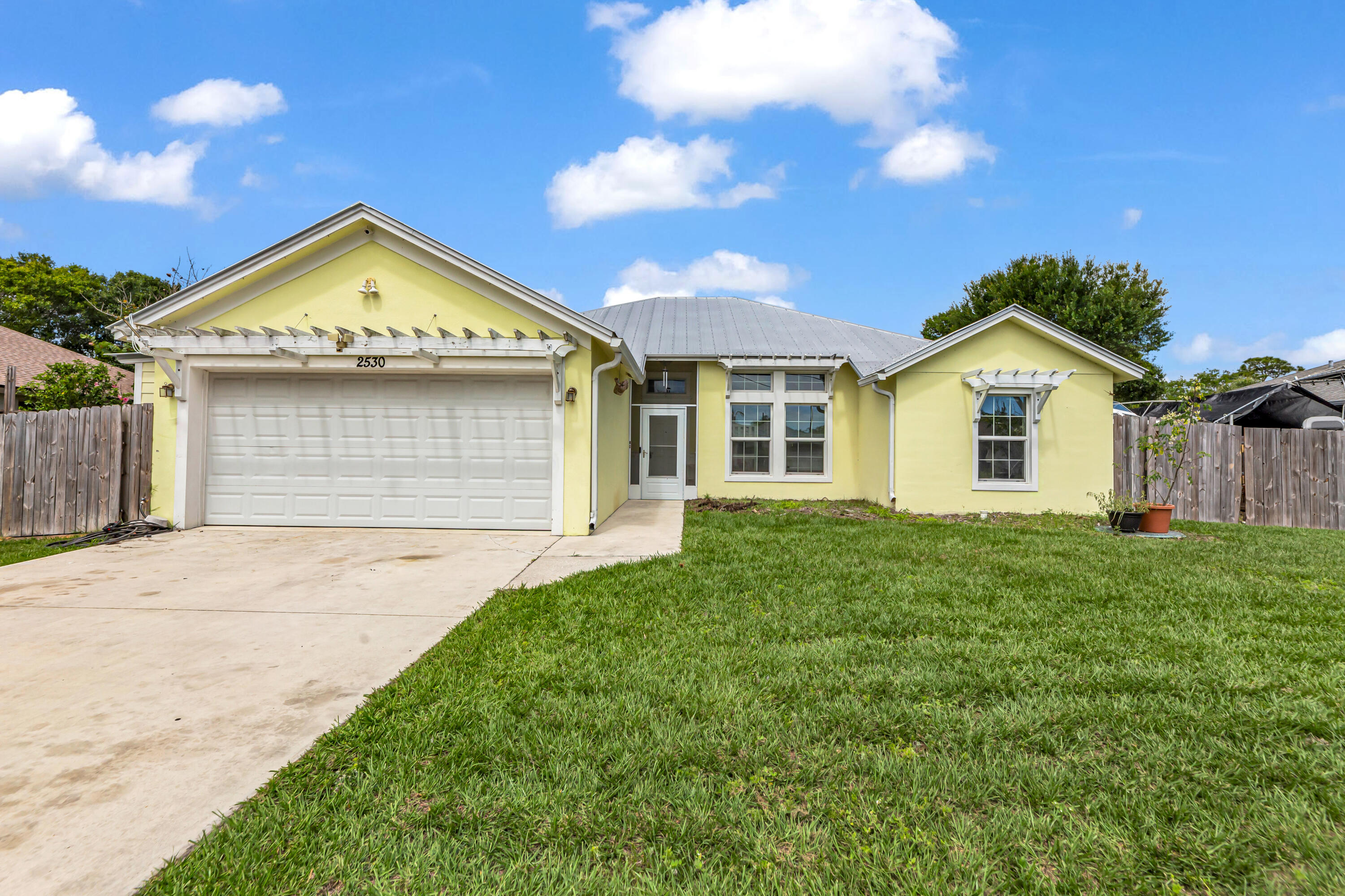 Welcome Home to this 3-bed, 2-bath waterfront home built in 2017 set on a peaceful canal.Perfect for fishing, canoeing, or kayaking right from your backyard. Designed for true Florida living, this home features a metal roof, full impact windows, and soaring 10-foot ceilings that create a bright, open feel throughout. Step outside to your private backyard oasis where you can relax, entertain, and enjoy the natural Florida surroundings. Plenty of space to store your boat or RV, plus an oversized garage with an epoxy-finished floor adds both function and style. Ideally located within walking distance to ocean-access boat ramp, making it a dream for boating and fishing enthusiasts. Just minutes to major highways, shopping, and great restaurants, this home offers the perfect lifestyle living.