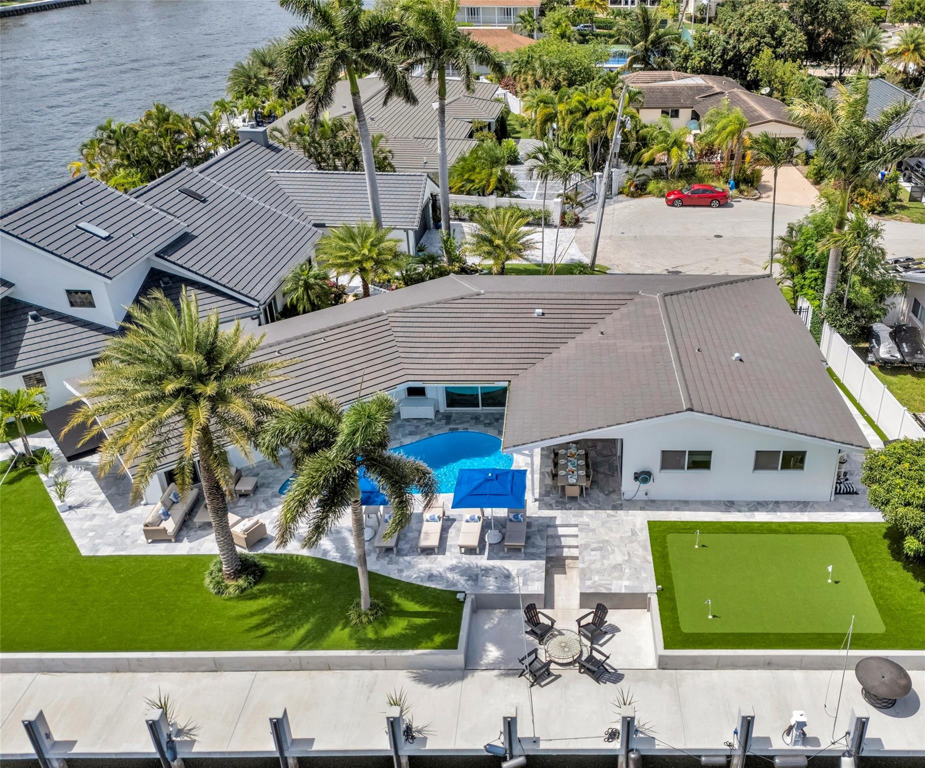 Villa Azul is a stunning waterfront estate available for short-, mid-, and long-term rental in Fort Lauderdale's prestigious Bermuda Riviera. Boasting 150 feet of deep-water frontage with no fixed bridges, this luxury residence offers breathtaking Intracoastal views and exceptional yachting access. Just a short 5-minute stroll to the beach, the villa features sophisticated open-concept living spaces, designer interiors, and seamless indoor-outdoor living. The private resort-style backyard showcases a heated pool, putting green, and expansive waterfront entertaining areas with front-row views of yachts cruising by. Ideally located minutes from Fort Lauderdale's finest dining, shopping, beaches, and nightlife, Villa Azul delivers the ultimate South Florida lifestyle experience.
