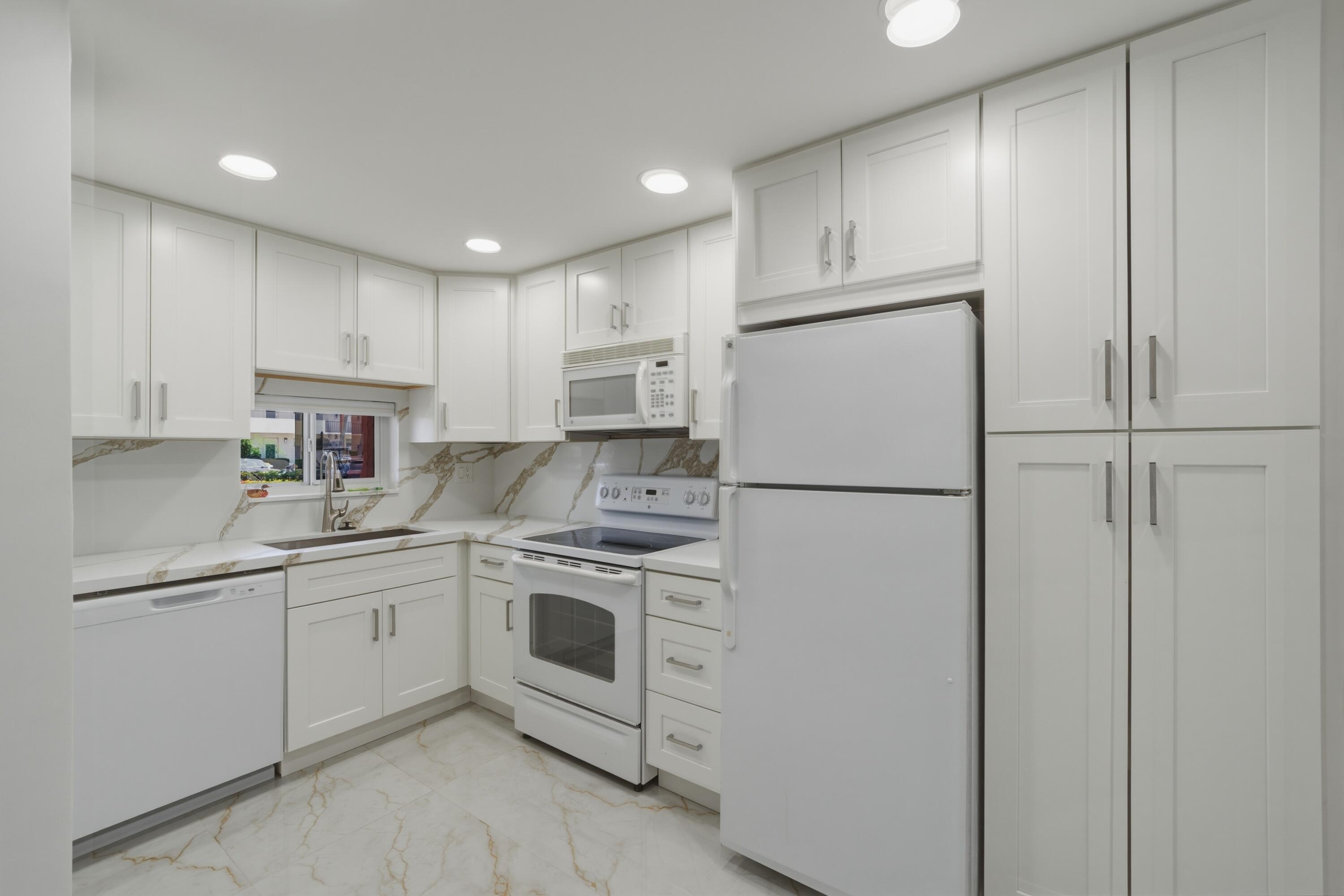 UPDATES! BEAUTIFUL! 1BR + Currently Bonus Room used as a bedroom and 2BA (both new showers). IMPACT WINDOWS AND DOOR! OPEN Kitchen featuring quartz countertop, backsplash and eat-in snack counter with extra storage. Modern LED lighting throughout. Quality :Laminate flooring in living areas. Tankless Hot Water Heater. Very nicely furnished. NORTH/SOUTH exposure. PAR 3 16th Green view from screened patio with weather shutters. Quiet cul-de-sac location. Recreation Lease PAID IN FULL! FREE golf (except cart fees) on two 18 hole courses (PGA & Par3); Amenities include Restaurant, Billiard Room, Bbq/Picnic Area, Clubhouse, Courtesy Bus, Exercise Room, Heated Pool, Library, Putting Green, Sauna, Shuffleboard, Tennis, Pickle Ball, Vehicle Wash Area, Electric Car Charging Station. MOVE RIGHT IN!