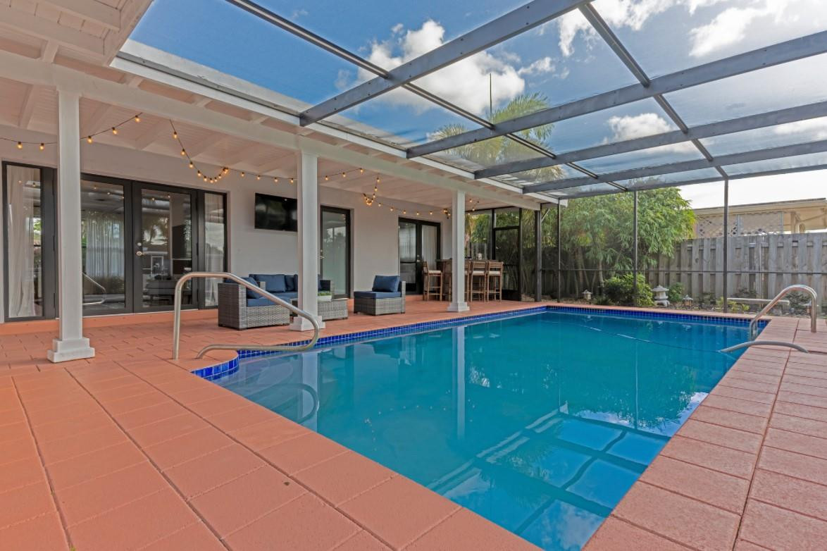 Welcome to your dream waterfront oasis in Plantation, Florida! This beautiful 3-bedroom, 2-bath pool home  Enjoy an open-concept living area filled with natural light, a modern kitchen with stainless steel appliances, and a spacious primary suite with an en-suite bathroom. Step outside to your private pool and patio area, ideal for entertaining or relaxing while taking in stunning water views. Located in a peaceful neighborhood, you'll be close to shopping, dining, and outdoor activities. Experience the best of South Florida living in this charming home! Schedule your viewing today!