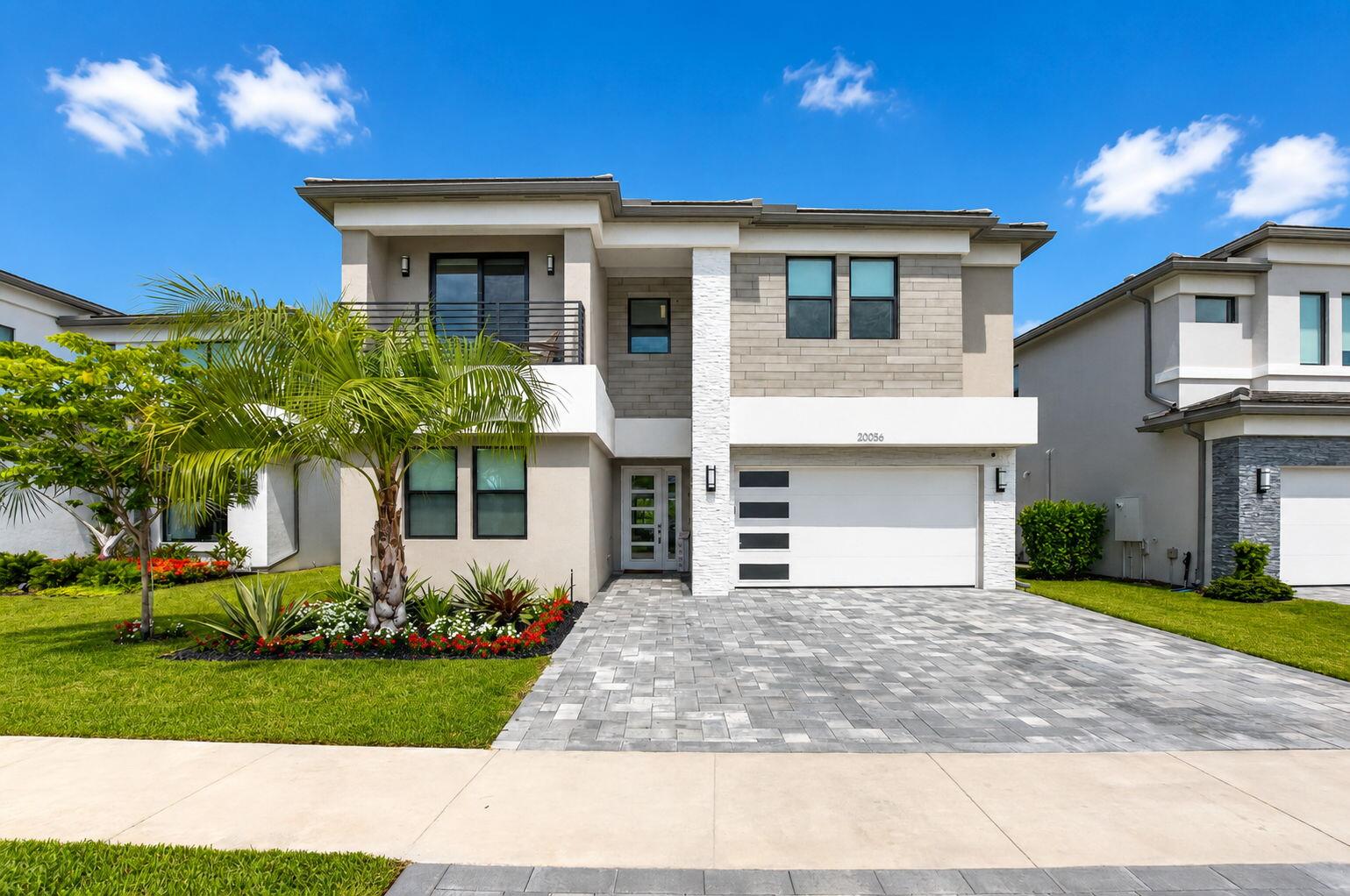 Experience luxury living in Lotus Palm in this exceptional Polynesia model offering 4,605 square feet with 5 bedrooms and 7 bathrooms on a premium west-facing lakefront lot. Enjoy breathtaking sunset views from your private backyard featuring a saltwater pool, gas heater, covered lanai with motorized screens, and a fully equipped outdoor kitchen. Inside, every detail has been thoughtfully upgraded with Wolf and Sub-Zero appliances, custom cabinetry, custom pantry and closets, upgraded bathrooms, designer lighting, Lutron smart home technology, motorized shades, whole-house generator, and timeless neutral finishes. Truly move-in ready. Enjoy Lotus Palm's resort-style clubhouse with pools, fitness center, tennis, pickleball, restaurant, and vibrant social events.