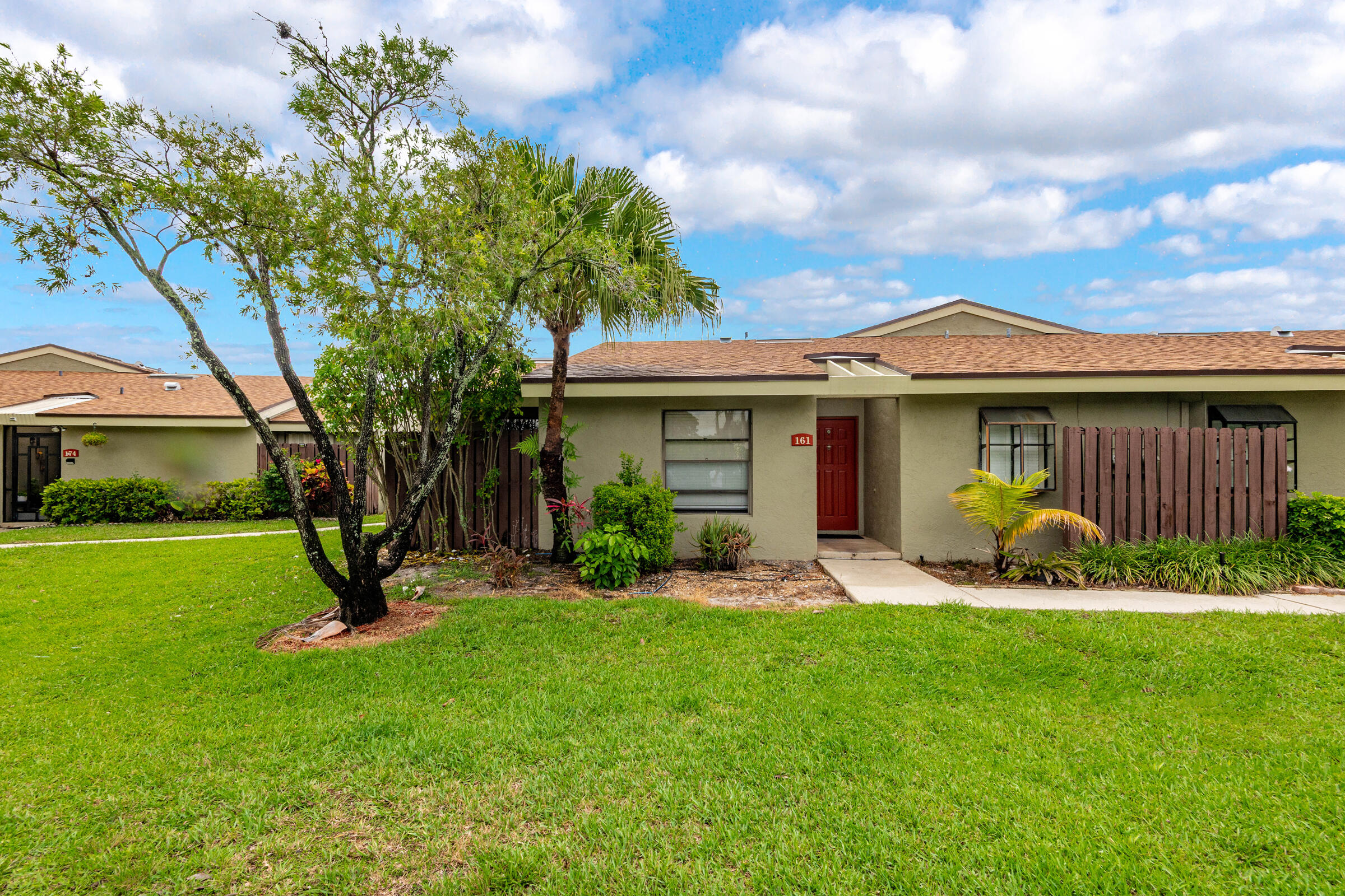 This beautiful 3/2 villa features tile and vinyl plank flooring throughout, no carpeting! Kitchen has been remodeled with newer cabinetry, granite countertops, and stainless steel appliances. The unit features vaulted ceilings, large bathrooms, a spacious laundry room with washer/ dryer included, and an open courtyard area plus a screened patio. The villa also has 2 assigned parking spaces and a community pool. This one is a must see! Also available for lease.