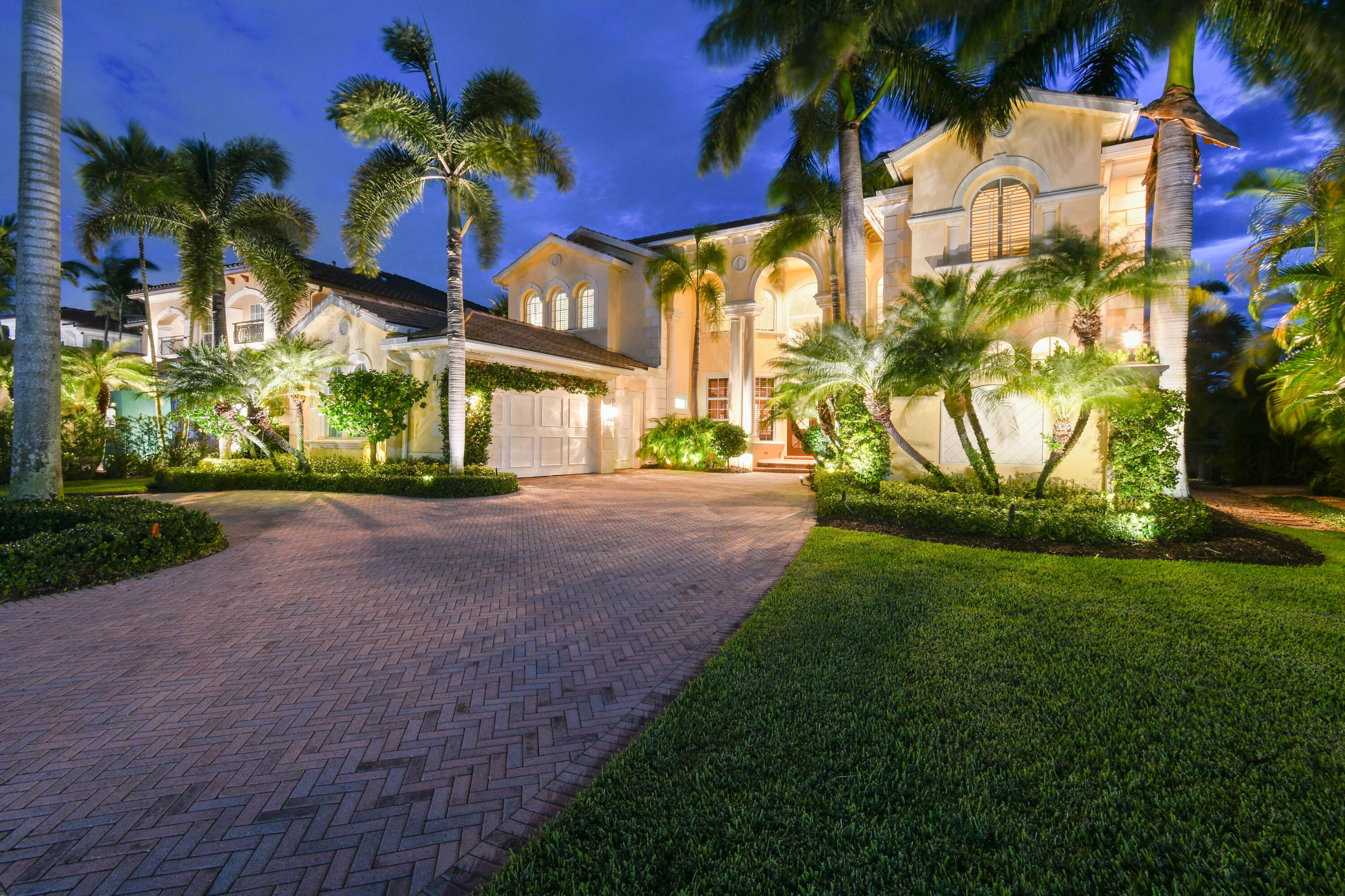 Discover unparalleled elegance in this estate home at 615 Hermitage Circle, a customized Villa Rosa, nestled within the prestigious Frenchman's Reserve in Palm Beach Gardens. A rare gem, this luxury residence offers sweeping vistas of the tranquil lake and the 18th hole of the championship golf course, with a backdrop of lush natural Florida greenery. This upgraded and expanded floorplan features 6 full bedrooms, 6 full bathrooms, 2 half bathrooms and a spacious office. 
From the moment you open the double doors you are welcomed with sweeping views, natural light and openness from the 24' ceilings and floor-to-ceiling wall of windows. An elegant entryway invites you to the formal spaces, with a full seating wet-bar and custom fireplace, rounding out the ideal entertainment space! The gourmet chef's kitchen is open concept with the spacious living area and breakfast nook, also overlooking the golf and water views. Updated with custom cabinetry, top of the line appliances, gas cooktop, trash compactor, extra backsplash windows and luxe 2' quartz countertops. The palatial primary bedroom shares the same views of the golf course and water features and offers both his and hers walk-in closets with custom built-ins. An additional room and closet are attached that can be used as a home gym, home office, dressing area or nursery. Dual bathrooms converge offering the ultimate convenience and comfort in this grand primary suite. Upstairs hosts additional living and lounging spaces with four gracious guest suites and stunning views. One of the rooms functions as a secondary primary suite with a private balcony, walk in closets and oversized spa bathroom with soaking tub and walk- in shower.
The impeccably designed exterior reveals a serene oasis that lives like a private resort. Don't miss a moment of outdoor enjoyment with multiple areas for lounging, dining, or cooking in the summer kitchen. A sleek infinity-edge pool and spa seemingly merge with the lake and golf course beyond for a stunning vantage point. Other home features include hurricane impact windows and doors, a full-home generator, custom woodwork and moulding throughout, custom lighting, electric blinds, decorative driveway, 2-car + golf cart garage, central vacuum.

This Villa Rosa home is more than just a residence; it's a lifestyle. In Frenchman's Reserve, residents enjoy access to world-class amenities including a private golf course, tennis/pickleball courts, a state-of-the-art fitness center, and a resort-style clubhouse all perfectly situated in ideal Palm Beach Gardens. A full-golf membership is available with this home, with an option to switch to a social membership.