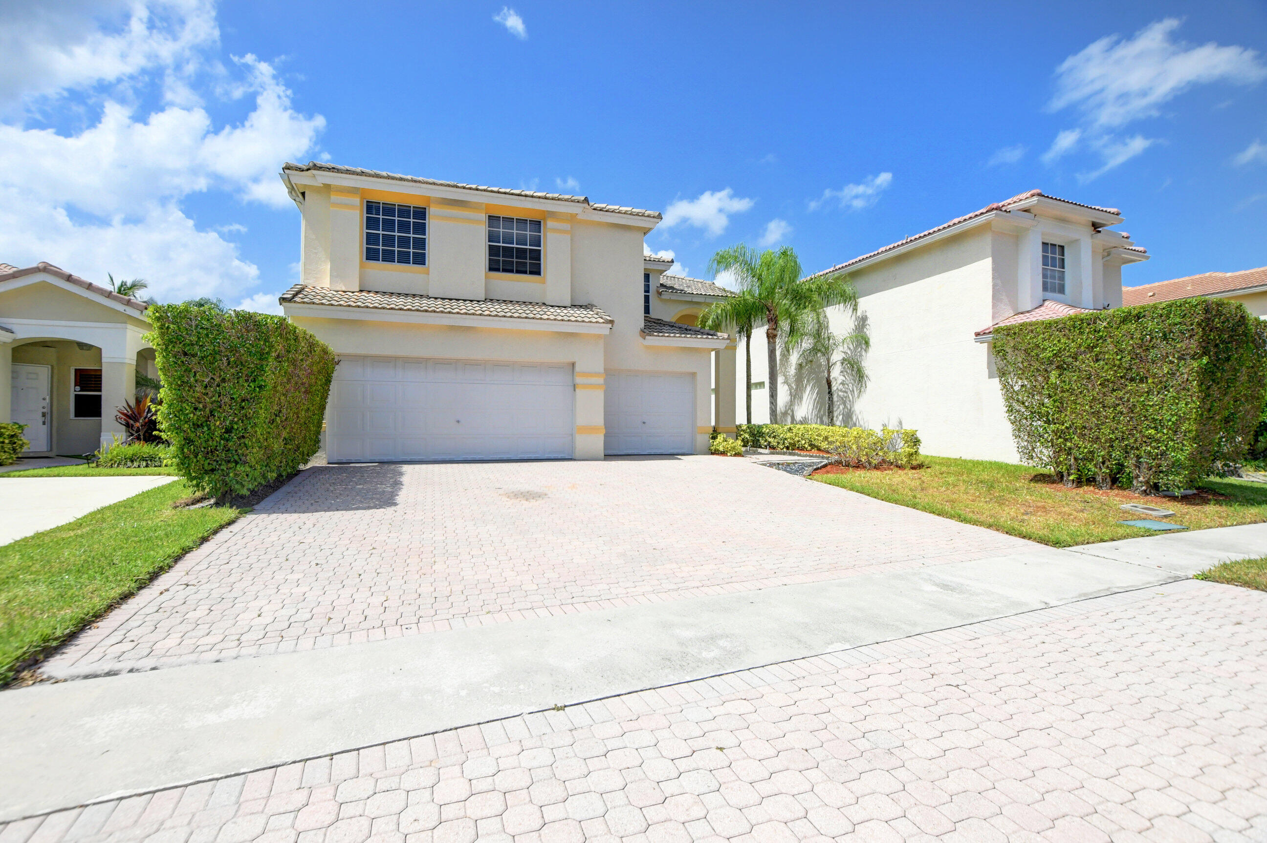 Welcome to this exceptional waterfront single-family residence nestled in Harbour Springs at Mission Bay in Boca Raton. This two-story home features four spacious bedrooms and 2.5 bathrooms with 2,655 square feet of finished living space, offering room for comfortable living and entertaining. The three-car garage provides ample parking and storage convenience. The waterfront location enhances the property's appeal and offers unique outdoor lifestyle opportunities. This thoughtfully designed residence combines functional layout with waterfront access in an established community setting.  Bathroom Renovated, Great High Ceilings Floor Plan: Newer Porcelain Tile and Wood Second Floor (No carpet). Kitchen in Mint Condition ((Dark Wood Color) and Granite Counter Tops(Beige Santa Cecilia). Pool a