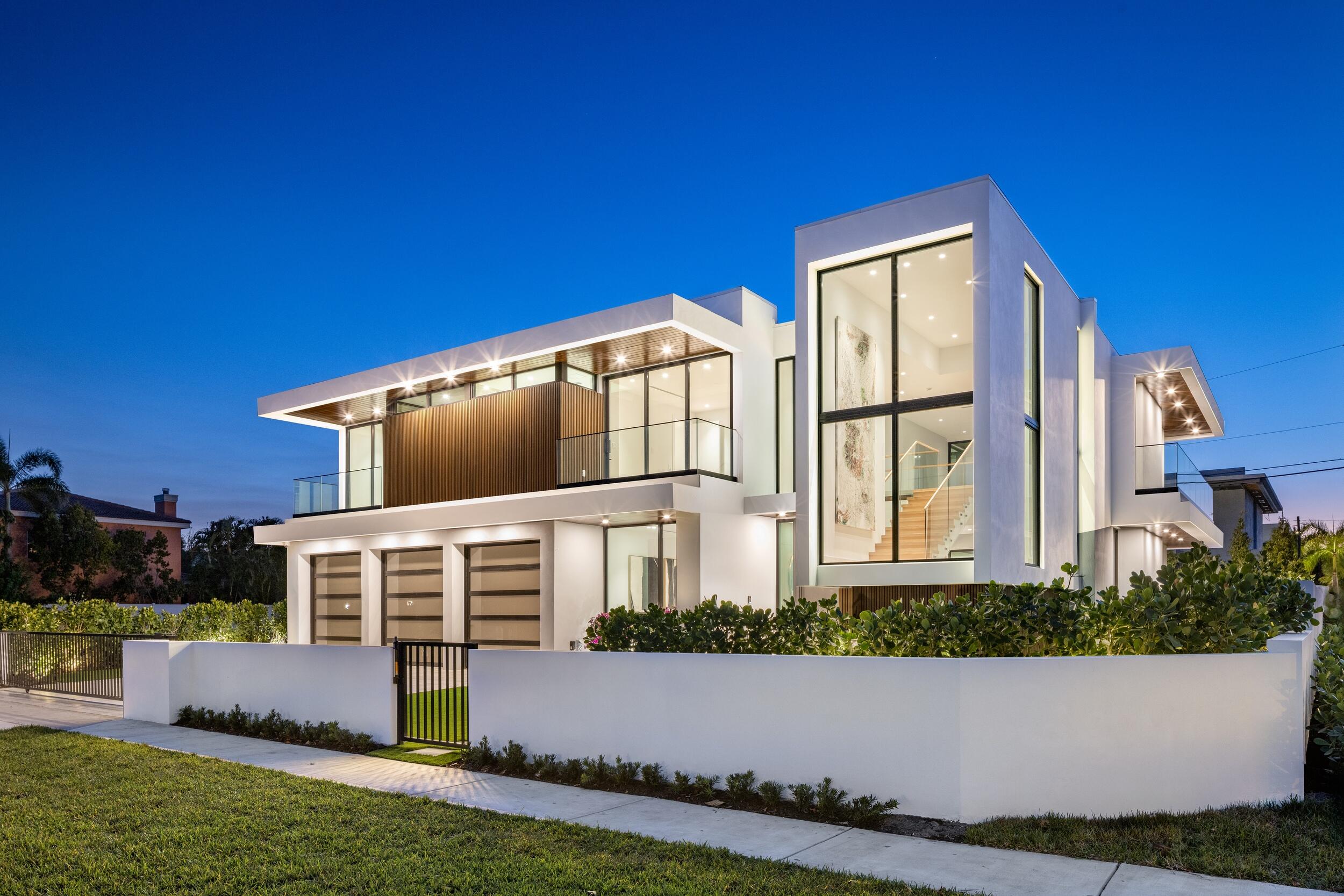 Welcome to Villa Tempesta at 1099 NE 4th Avenue, Boca Raton; a newly completed ultra-luxury estate located in the highly sought-after community of Boca Villas. Encompassing approximately 6,641 total square feet, this exceptional new construction home offers six bedrooms, six full bathrooms, and one half-bath, thoughtfully designed for elevated modern living. Set on a prime corner lot in downtown Boca Raton, the residence enjoys a coveted location just moments from Mizner Park, The Boca Raton, and some of South Florida's most celebrated beaches. Villa Tempesta showcases a masterful contemporary aesthetic defined by clean architectural lines, dramatic scale, and meticulous craftsmanship. Upon entry, soaring ceilings and expansive glass invite natural light throughout, creating a refined yet inviting ambiance. Luxury finishes and custom details are evident at every turn, reflecting an uncompromising commitment to quality. The heart of the home is a striking chef's kitchen, anchored by breathtaking natural marble countertops, a gas Wolf range, SubZero appliances, and bespoke cabinetry, seamlessly opening to the dining and family rooms, ideal for both everyday living and sophisticated entertaining. A private office and temperature-controlled wine room add thoughtful functionality, while porcelain tile flooring on the main level and white oak floors upstairs lends timeless elegance. Five tranquil bedroom suites are located within the main residence, each featuring a beautifully appointed ensuite bath. The primary suite serves as a serene retreat, highlighted by a spa-like bathroom with dual water closets and dual walk-in closets, offering exceptional comfort and privacy. Two separate laundry rooms further enhance the home's livability. A standout feature of Villa Tempesta is the detached guest house, offering complete privacy with its own living area, kitchenette, spacious bedroom, and full bathroom that also functions as a cabana bath perfect for guests or extended stays. Outdoors, the backyard is your own private resort with a spectacular pool and spa that are complemented by a summer kitchen and al-fresco dining area. The entire residence is enclosed by a 6-foot concrete privacy wall, mature landscaping, and secured by a motorized gated driveway; ensuring discretion and peace of mind. Completing this remarkable residence is a three-car garage, a home power-generator for added safety and comfort, and an exceptional level of detail rarely found in new construction. 1099 NE 4th Avenue represents a unique opportunity to own a newly-built luxury estate in East Boca Raton where timeless design meets modern sophistication. DISCLAIMER: The information herein is believed to be accurate but not guaranteed and may be subject to errors, omissions and changes without notice. All measurements, dimensions, room sizes, and lot sizes are approximate. All such information should be independently verified by any prospective purchaser or seller. Parties should perform their own due diligence to verify such information prior to a sale or listing. Listing company expressly disclaims any warranty or representation regarding such information.