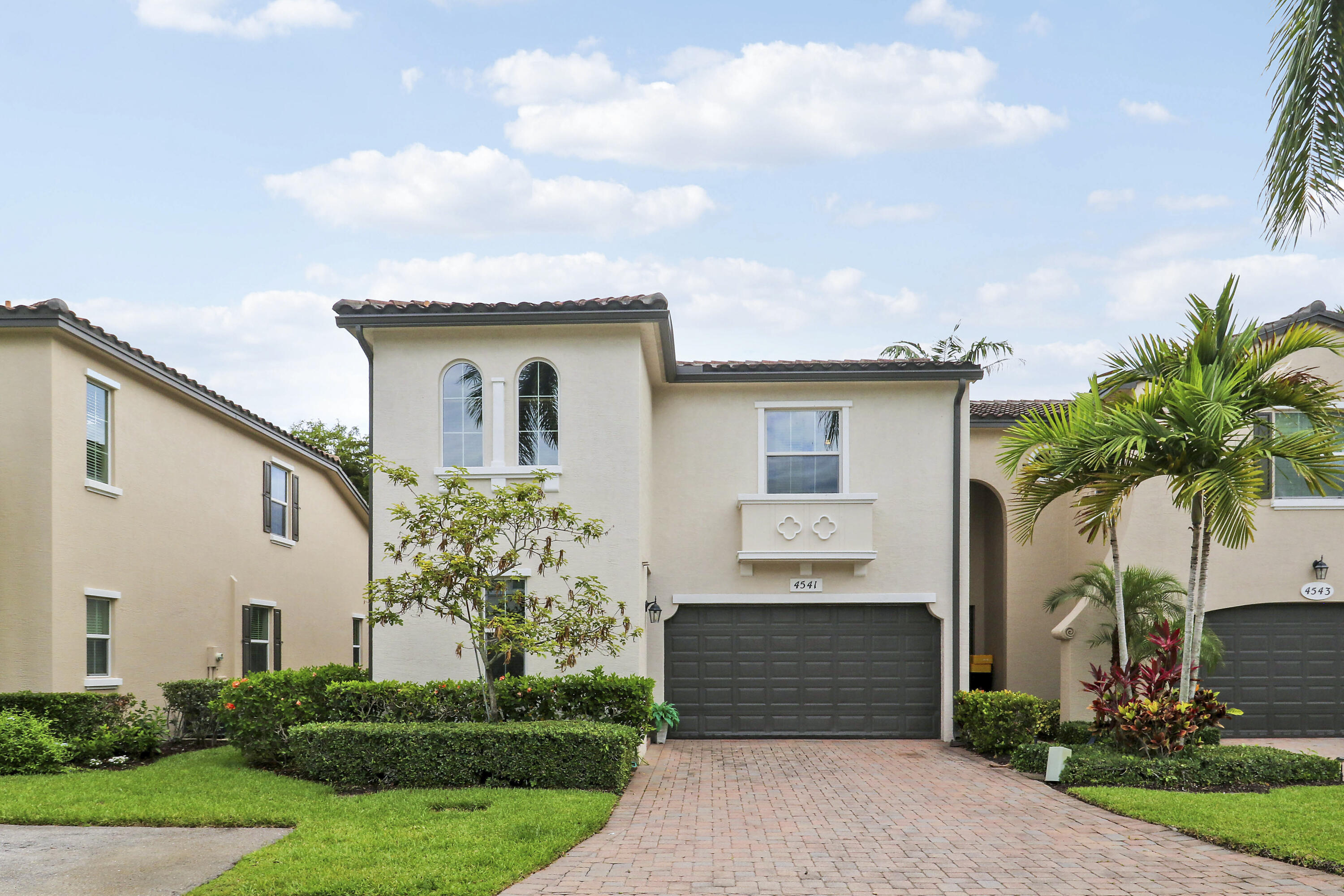 Welcome to this end unit townhome in Trevi at the Gardens, located in Palm Beach Gardens, Florida. This two-story residence offers three bedrooms and two and a half bathrooms within 1,734 square feet of living space. With the master suite located on the ground level, this townhome is suitable to any and all buyers! The home boasts complete impact glass, outdoor patio, 2 car garage, community pool and much more. Schedule your showing today!
