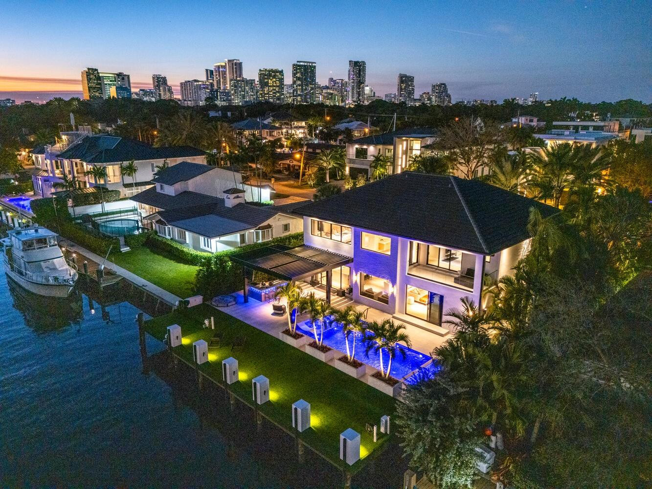 RIO VISTA, Fort Lauderdale's charming & historic neighborhood in the heart of the city move in ready waterfront home, minutes to inlet, yacht club, LAS OLAS & airport. Renovated in 2022, 6 BED/6.5 BATH, 75’ OF WATERFRONT w/ power lift, UP TO 5000 LBS, open floor plan, volume ceilings, expansive doors blend indoor/outdoor living. Gourmet kitchen, top of the line appliances & storage, open to the great room, overlooking the saltwater pool, summer kitchen w/ blaze gas grill/griddle, motorized PERGOLA. 2 car garage w/ power for car lift, mudroom & custom storage. Full house generator.  Guest & playroom on 1ST floor. 2ND floor primary suite w/ watermist fireplace, large walk-in closet, spa like bathroom & adjacent gym/bedroom. 3 bedrooms with ensuite baths & laundry room.