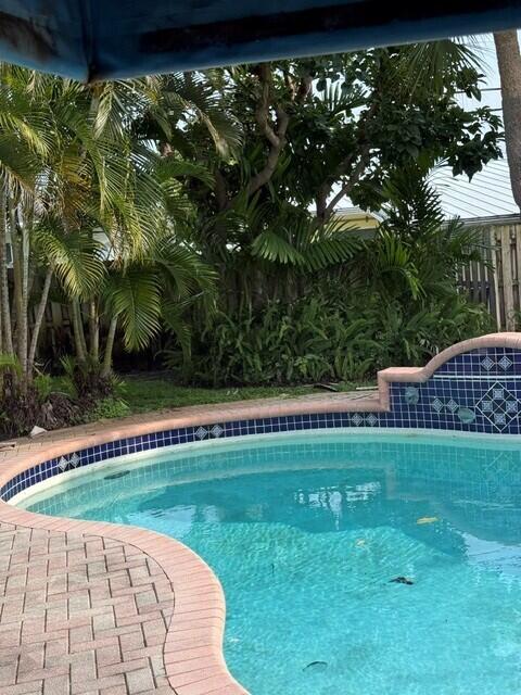 POOL HOME in amazing Mary Knoll Residenrial Neighborhood. This 2 full bedroom, 2 Bath home can easily be a 3 bedroom. New A/C/Heater, Generator for entire house in case of loss of electricity. 2 car garage with parking for 4 cars in driveway. Large swimming pool w/water fall. P Storm windows and front bay window.. Huge den/family room. Has been lovingly maintained and cared for. Xtra refrigerator in garage. Front lawn is very spacious. Everything in the house is in excellent working condition. Florinada school district. Easy access to Commercial Blvd and Federal Highway even though it is in a quiet family neighborhood. Priced below actual value for easy purchase. Property Value Per Broward Coubty $819,349. House priced at $789,888, alnost $30,000 below market value. Extra Refrigerator in Garage. Property Value Per Broward Coubty $819,349. House priced at $789,888, alnost $30,000 below market value Full Generator for entire house. Brand new A/C
