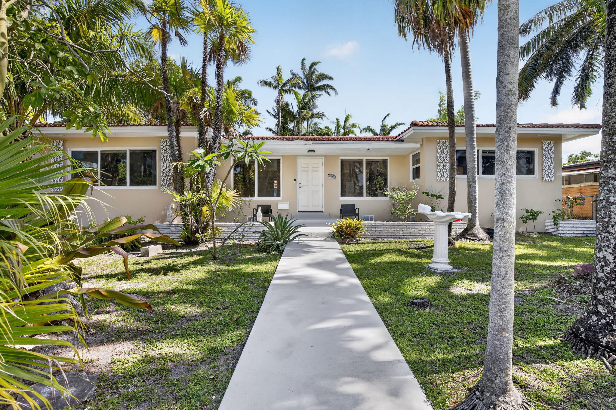 Charming 3-bedroom, 2-bath home located in desirable Hollywood Lakes, just minutes from Hollywood Beach and the famous Broadwalk. This property features classic Old Florida charm with inviting living spaces, abundant natural light, and a warm coastal feel throughout. Tropical landscaping creates a private setting perfect for relaxing or entertaining. Ideal as a primary residence, vacation home, or investment property. Prime location close to beaches, dining, shopping, parks, and all that South Florida living has to offer.