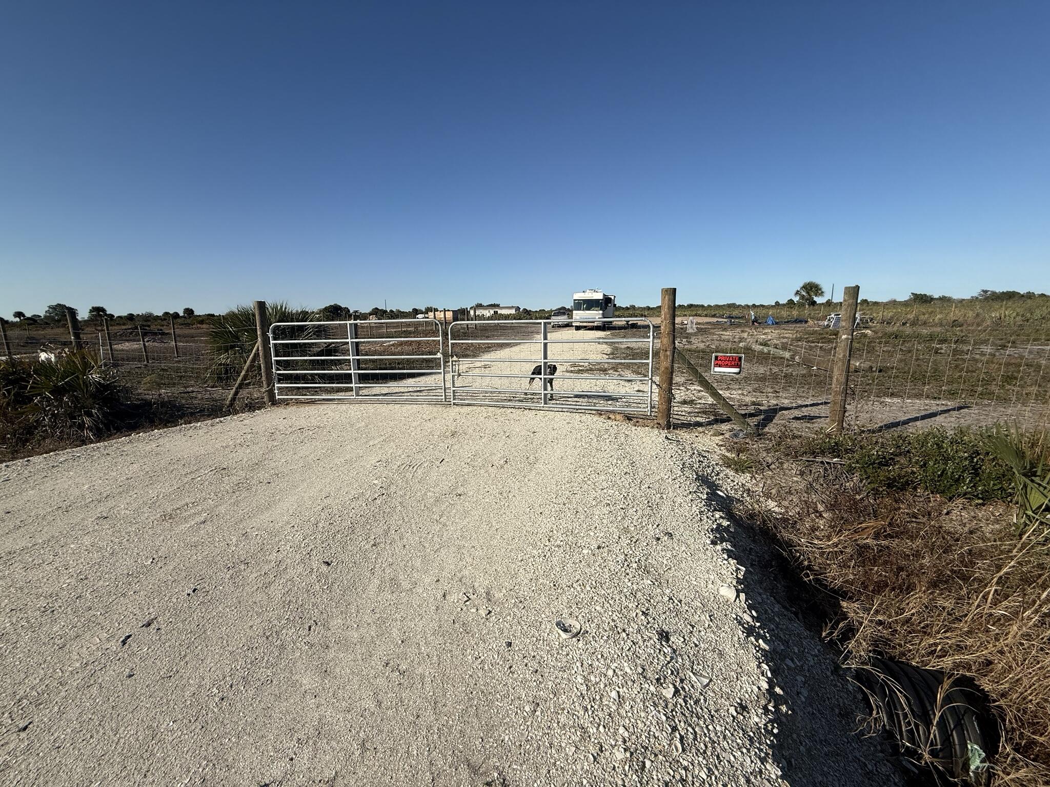 Beautifully cleared 2.5-acre parcel ready for your vision. This versatile property features agricultural fencing with subdivided sections, making it ideal for livestock, farming, or a rural homestead. A solar-powered well is already in place, offering a valuable head start on utilities. The property includes a dirt house pad and a recent survey, providing convenience and clarity for future plans. Two goat houses have been added. Enjoy peaceful country living with open space, flexibility, and endless potential.