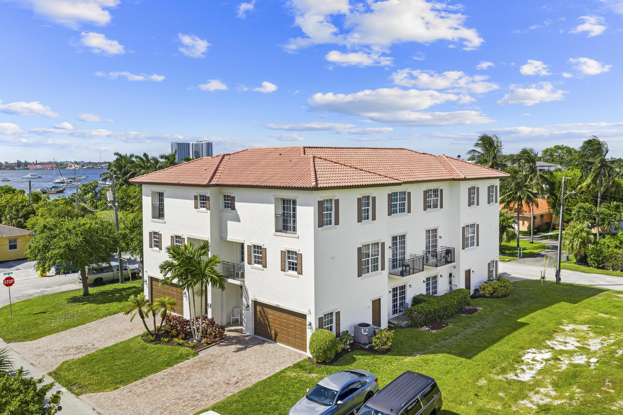 Prime investment opportunity on Singer Island! Four turnkey tri-level townhome-style units, each with a private elevator, 3 bedrooms, 3.5 baths, and open second-floor living spaces with balconies offering water views. Built in 2006 with full impact windows. Each unit features a garage, modern kitchens, and spacious layouts ideal for long-term tenants or short-term/vacation rental income. Located just steps from the beach, marinas, boat ramps, and waterfront dining—this property is perfectly positioned for the boating and beach-going lifestyle that drives strong rental demand year-round. Projected gross rental potential of $400K+ annually with flexible use options. Rare opportunity to own a high-income, low-maintenance coastal asset in one of Palm Beach County's most desirable submarkets.