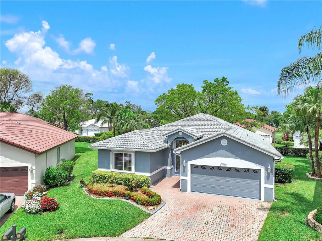 Spacious 3-Bedroom, 2-Bath Home with 2 Car Garage. Nestled in the Small All-Ages Gated Community of Avalon Estates in Woodmont. This Beautiful Home is Located on a Just Over 1/4 Acre in a Cul-de-sac & Includes Hurricane Shutters, New Barrel Tile Roof installed 2022 and an Expansive Screened Patio. Features include Volume Ceilings w/ Recessed Lights, Split Bedroom Floor Plan, Remodeled eat-in Kitchen w/Stainless Steel Appliances, Granite, Built in Cabinetry with Pantry & Breakfast Area. Laundry Room w/full size Washer/Dryer. Tile and Laminate Floors throughout Living Areas, Carpet in Bedrooms. Master Suite Boasts 2 His/Hers Walk-in Closets, Separate Dual Sinks/Vanity, Roman Tub & Separate Shower. Low HOA includes Lawn Care, Sprinkler Maintenance and Community Pool. Pets Welcome!