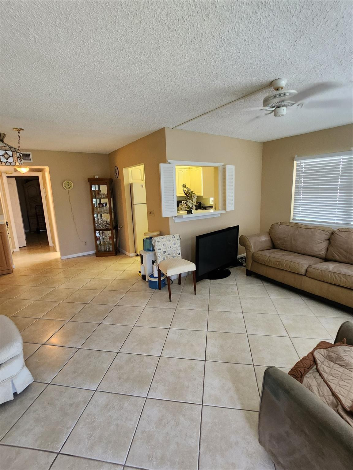 Investors only. This spacious rentable immediately 1st-floor corner unit is now rented, and features 1 bedroom and 2 bathrooms, offering privacy and comfort with a stunning water view. Step outside to your private patio, perfect for entertaining with your own barbecue grill and space to unwind. Located just 3 miles from the beach, this home is nestled in a vibrant community with resort-style amenities: clubhouse, gym, restaurant, indoor/outdoor heated pools, tennis, pickleball, social clubs, events, and community transportation.