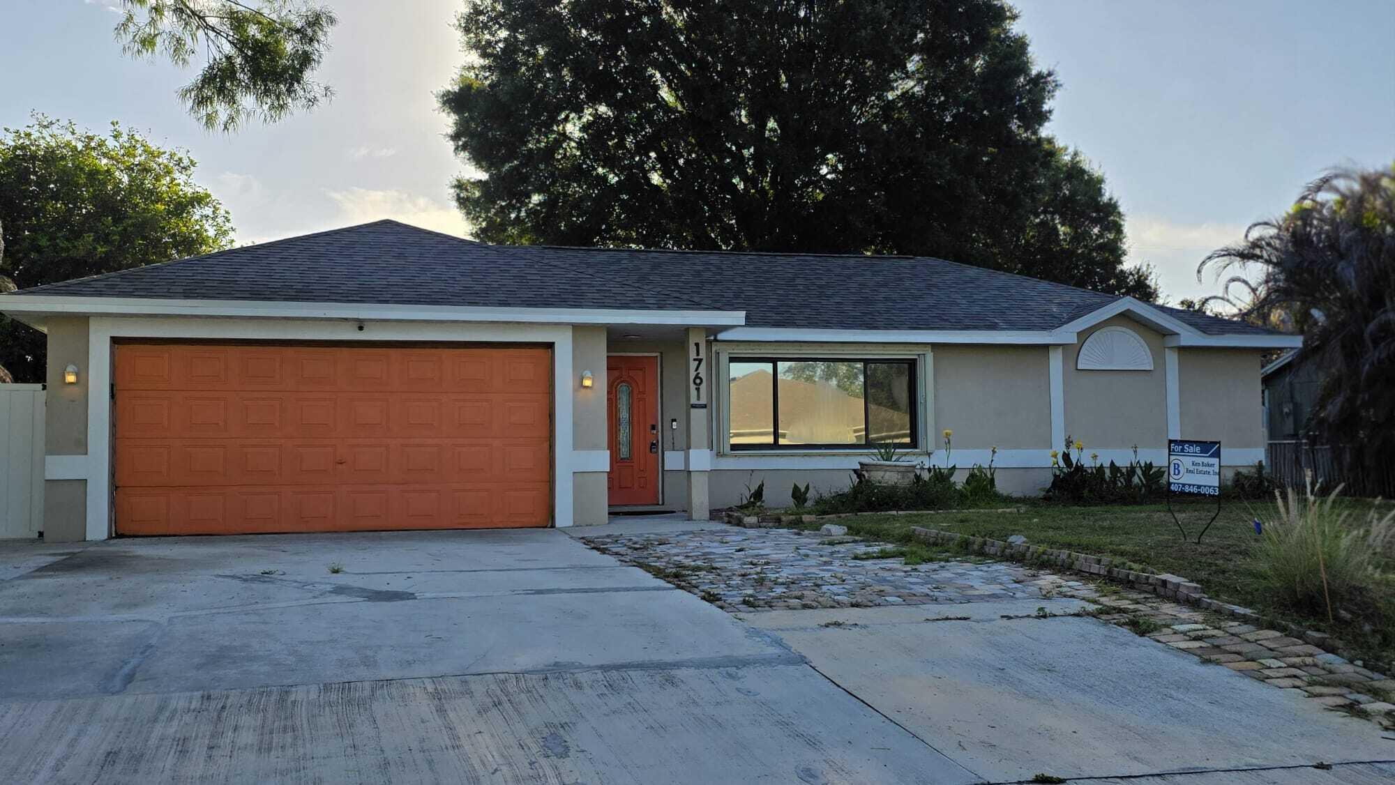 BRAND NEW ROOF! Ready for you to occupy! this versatile home in Port St. Lucie, Florida, offering flexible living spaces and a layout full of character. Featuring 3 bedrooms and 2 baths, plus a converted garage apartment with its own private entrance, bathroom, and kitchenette perfect for guests or extended family.  Step through the foyer with French doors into a spacious tiled great room, which flows into a separate family room accented by wood flooring and a stylish barn door creating defined yet connected living areas. The split floor plan provides added privacy. The kitchen comes equipped with appliances and solid wood cabinetry. Outside, enjoy a fenced backyard with lots of potential to create your perfect relaxing oasis. This home is perfect for multi-generational living options.  Room sizes are approximate and should be independently verified by buyer.  Property may be under audio and video surveillance.