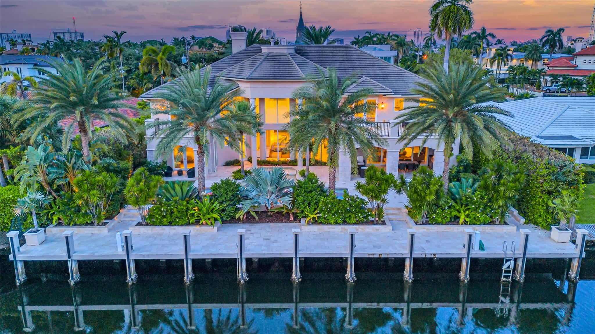 Introducing an exquisite luxury estate built in 2013 nestled in the prestigious gated Harbor Beach This architectural masterpiece offers 6 ensuite bedrooms 7.2 lavish bathrooms a grand media room, executive office and a state-of-the-art gym. The gourmet kitchen is a chef’s dream, a Viking 6-burner gas range, dual Miele ovens, dual Viking refrigerators/freezers and a butlers pantry. Spectacular temperature-controlled wine cellar, formal dining room, and sophisticated second living room with a cozy fireplace. The movie/media room with oversized screen, Outdoor living with a climatized summer kitchen, expansive veranda, sundeck, and a stunning swimming pool, complete with a cabana bath and outdoor shower. 100ft concrete dock Crestron smart home technology throughout and full-house generator Introducing an exquisite luxury estate, crafted with meticulous attention to detail in 2014, nestled within the prestigious gated enclave of Harbor Beach. This architectural masterpiece offers 6 opulent ensuite bedrooms, 7 lavish bathrooms, 2 elegant powder rooms, a grand media room, executive office, and a state-of-the-art gym. The gourmet kitchen is a chef’s dream, featuring a Viking 6-burner gas range, dual Miele ovens, 2 dishwashers, dual Viking refrigerators/freezers, a Miele espresso bar, and a butler’s pantry. Entertain in style with a separate temperature-controlled wine cellar, perfectly complementing the formal dining room, and relax in the sophisticated second living room with a cozy fireplace. The dedicated movie/media room invites you to experience cinematic luxury with an oversized screen. Outdoor living is elevated with a climatized summer kitchen, expansive veranda, sundeck, and a stunning swimming pool, complete with a cabana bath and outdoor shower. A 100 ft concrete dock, Crestron smart home technology throughout, and a full-house generator ensure that this estate redefines luxury living.