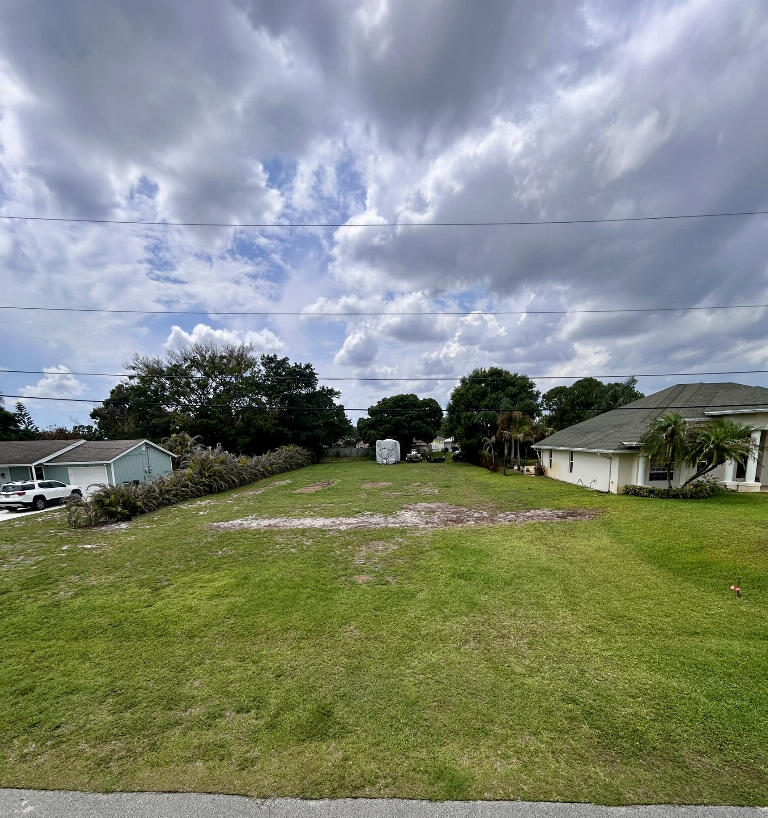 .36acres, Cleared Oversized Lot  Prime Oversized Vacant Lot - Ready to Build in Port St. Lucie  Build your dream home on this exceptional 15,757 sq ft cleared lot located at 145 SW Elderberry Drive in the highly desirable 34953 area of Port St. Lucie, Florida.  This oversized parcel offers significantly more space than most nearby lots and backs to a peaceful canal, providing an additional 65+ feet of easement buffer for enhanced privacy and relaxing water views. A recent official survey is included, confirming boundaries and buildable area.  Located on a street lined with newer, well-maintained homes, this property is surrounded by a clean, growing, family-friendly neighborhood.  No HOA — no fees, no approvals, no restrictive rules. Bring your vision and build without unnecessary limitati