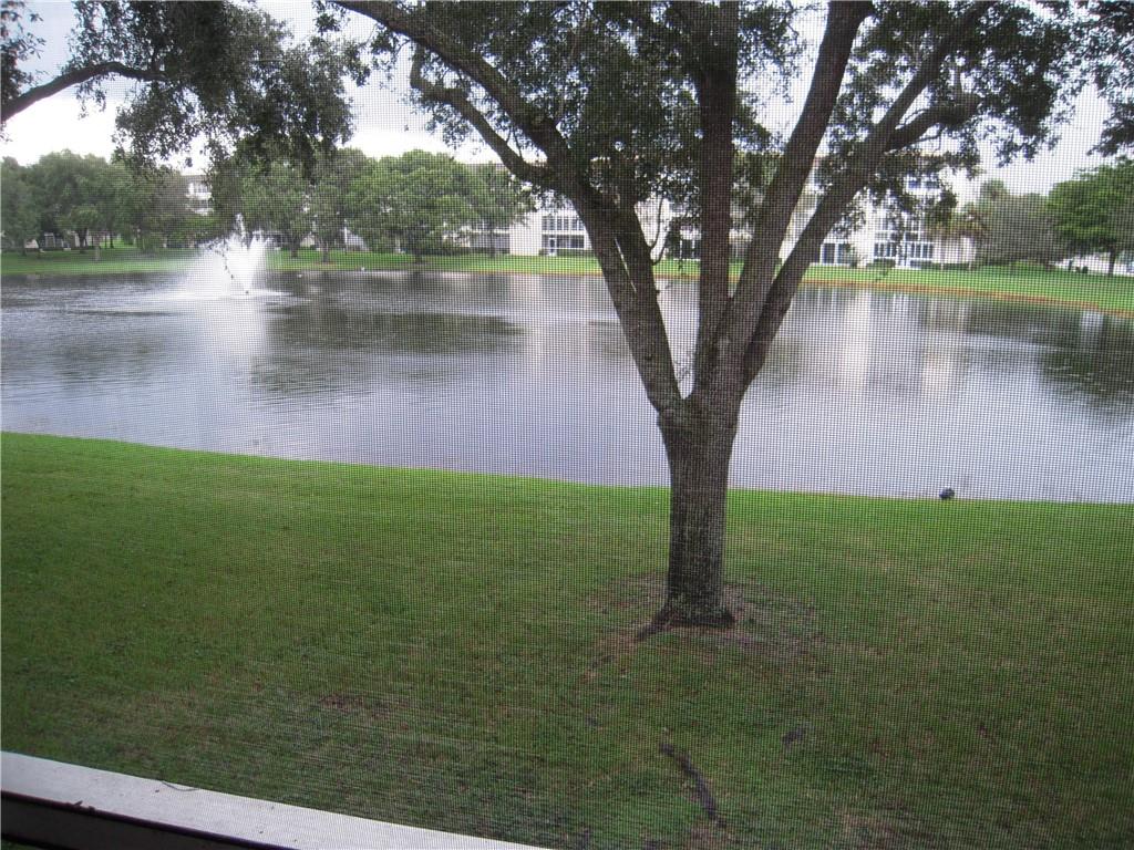 SPACIOUS 2 BEDROOM 2 BATH SPLIT WATERFRONT CONDO. ENJOY TRANQUIL PANAORAMIC LAKE AND FOUNTAIN VIEWS FROM YOUR LARGE SCREENED BALCONY. SPACIOUS EAT IN KITCHEN AND LARGE LIVING/ DINING AREA. WALK IN CLOSET IN MASTER AND LG. CLOSET IN GUEST ROOM. CONDO IS CONVENIENTLY LOCATED ON 2ND FLOOR AND PARKING SPACE CLOSE BY. LAUNDRY ROOM AND EXTRA STORAGE ON EACH FLOOR..WYNMOOR IS A GATED 55+ COMMUNITY AND HAS MOVIE THEATRE, RESTAURANT, BUS SERVICE, GOLF, TENNIS, PICKLE BALL, BILLARDS, LARGE GYM, 19 POOLS AND MORE. THIS APT. COMES FULLY FURNISHED AND AS IS.LOW MAINTENANCE FEES AND GOOD FINANCIALS. BACK ON MARKET AS BUYER WAS DECLINED DUE TO LOW CREDIT SCORE. THE OWNERS ARE:  MALEK AND SARBOUHI HANOUNIK.