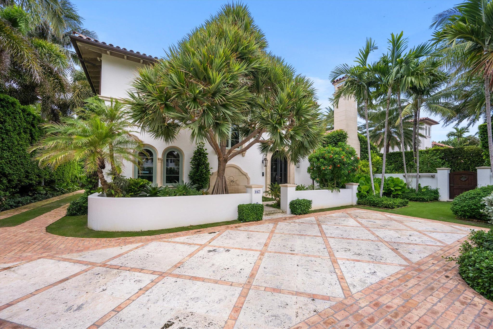 Stunning ocean block, custom 4-bedroom, 4.2-bath home spans 6,030 sq. ft. and showcases timeless elegance with modern luxury. Designed by Thomas Kirchhoff, the residence features a first-floor master suite, study, and a chef's kitchen with a center island opening to a spacious family room and screened loggia overlooking a lush yard, pool/spa, and cabana bath. Upstairs offers three en-suite bedrooms, a sitting room, a wet bar, laundry, and a large terrace—perfect for guests. High end finishes include extensive pecky cypress woodwork, custom millwork, 10-foot ceilings, a wine wall with a 450-bottle fridge, two gas fireplaces, multiple fountains, and a two-car garage. Deeded beach access and a full house generator complete this exceptional offering.