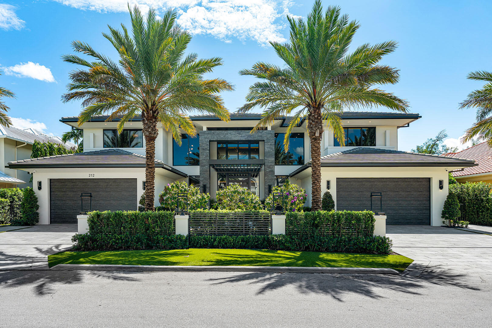A striking new waterfront estate by Albanese & Sons, architecture by BE Design, and interiors by Zelman Designs, debuts in Royal Palm Yacht & Country Club. This ultra-luxury residence spans just over 9,000 sq ft of refined interiors with 100 feet on the Royal Palm Waterway and captivating Capone Island nature preserve views. Thoughtfully designed for effortless living and grand entertaining, it features a club room with bar, glass wine display, wellness suite with sauna and steam shower, and a state-of-the-art Control4 innovative system. Outdoors, a southern-facing infinity pool, spa, and sunken fire pit create a private resort ambiance. Don't miss this extraordinary turnkey masterpiece.