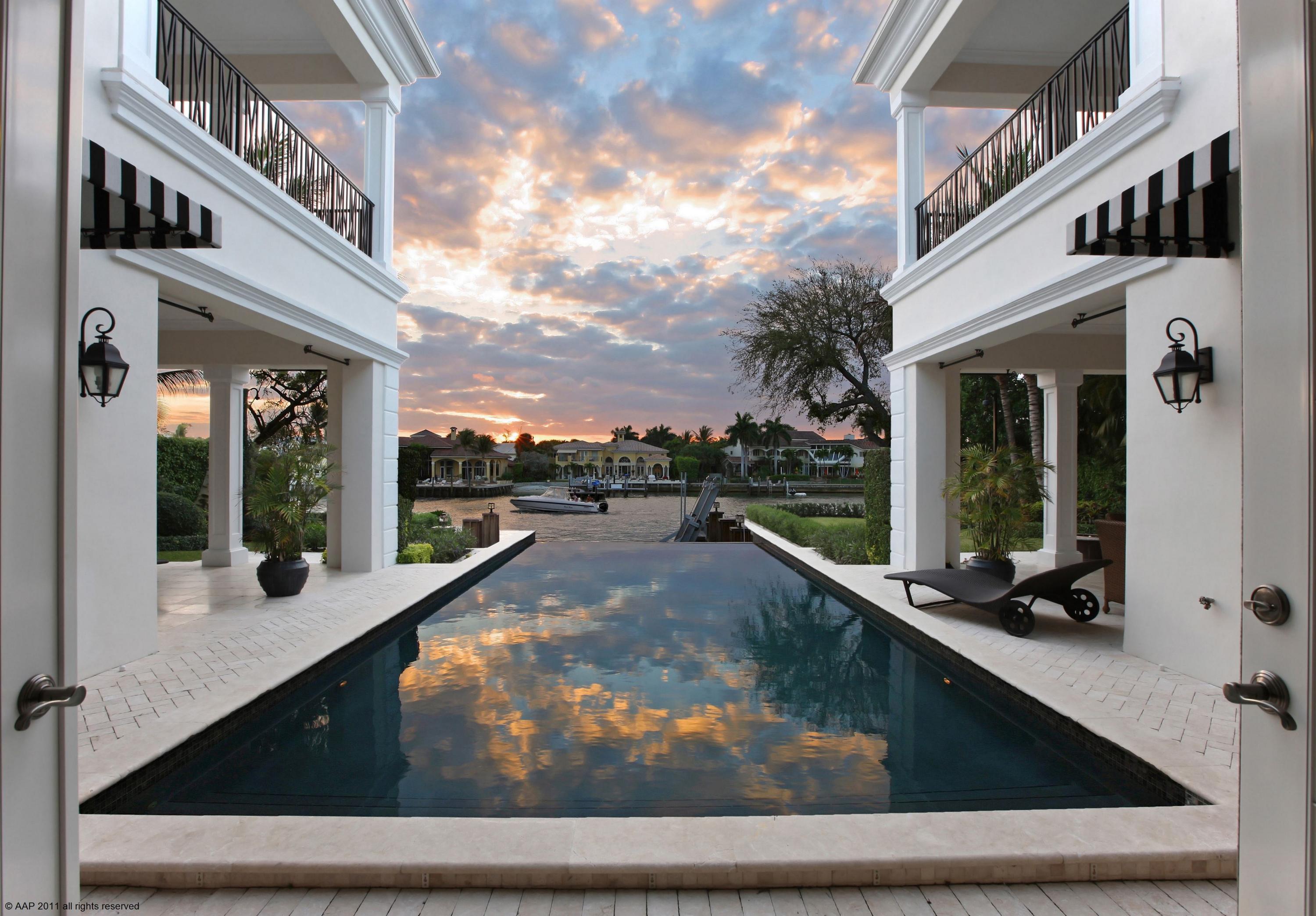 Grandly-proportioned private gated waterfront estate in Boca Raton’s most prestigious enclave epitomizes South Florida luxury at its best. Nestled on a third of an acre of pristine island-side grounds, with over 90+/-’ of Intracoastal Waterway awaits in this exclusive retreat and a one-of-a-kind offering.