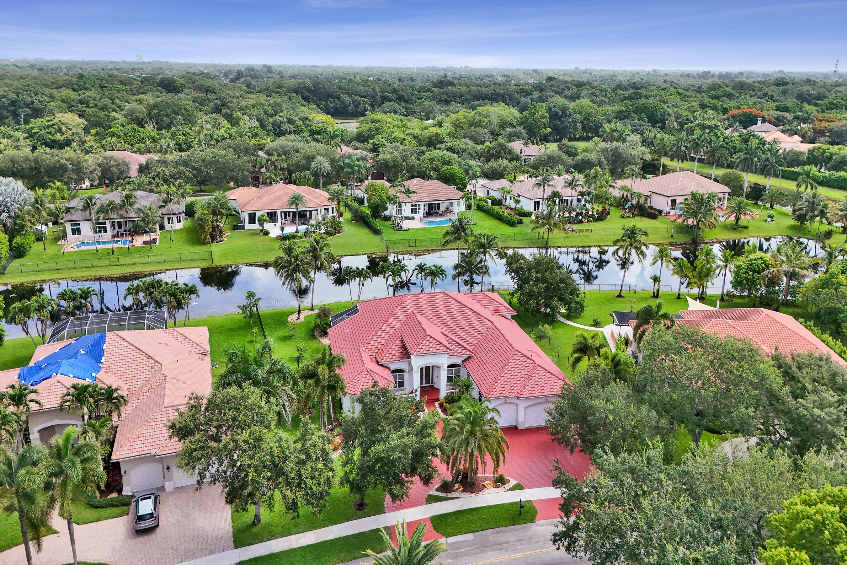 Original owner of the largest model in Imagination Farms. Move-in ready with new hardwood floors in all bedrooms and bathrooms remodeled in marble and travertine. Office converts easily to a 5th bedroom. Huge screened patio opens to an oversized pool. Full smart home: lighting, door locks, pool pump, water heater, A/C, garage door, and alarm. Impact windows on front, accordion shutters on back, all entry and garage doors impact rated. Carrier A/C units under 2 years old. Water heater and pool pump less than 1 year old. 17,500-watt whole-house generator. High-end LG kitchen appliances and washer/dryer. Private gated community with 24/7 security, playgrounds, and basketball courts. Interior and exterior security cameras convey with all smart home features. Owner showing home. Seller is License FL Real Estate Agent with Listing Brokerage. Owner is showing home, do not call listing agent.