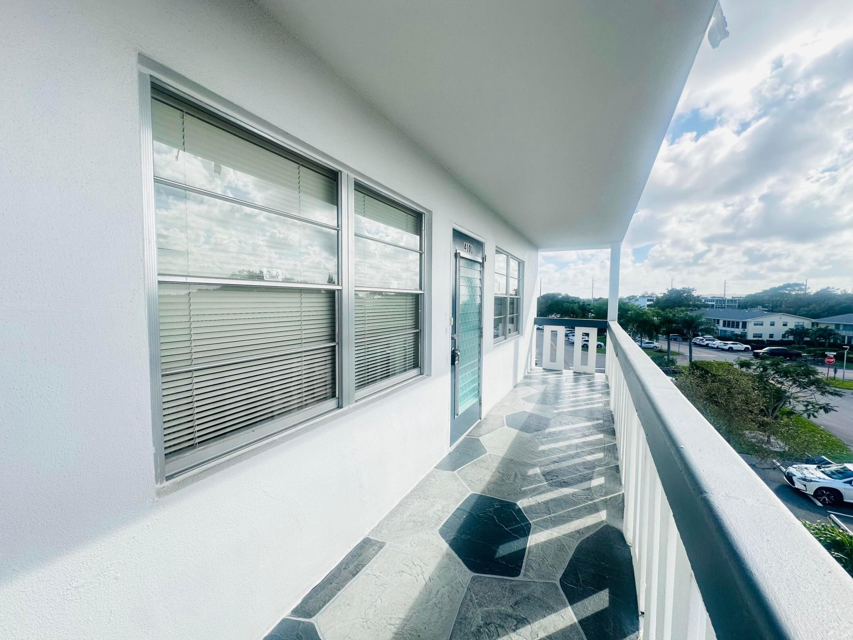 Wake up to BEAURTIFUL sunrises & tranquil LAKE VIEWS from this CORNER 2 bdrm, 2 bath 4th fl condo. This bright residence offers ceiling fans in every rm, mirrored liv rm wall & an encl patio w/plexiglass windows & hurricane accordion shutters for added security.  The original kit & baths provide a wonderful opportunity to design the space exactly to your taste. Brand-new roof on the bldg & just a short walk to the pool $ clubhouse. Fantastic location & a great chance to create your dream home.