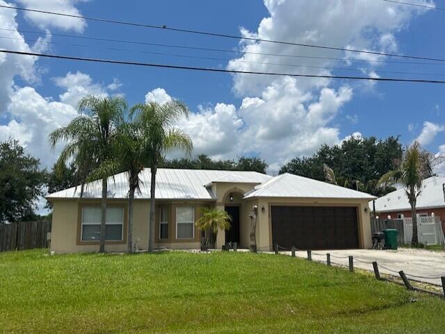 Beautiful 4-Bedroom Home in the Highly Desirable Torino Area of Port St. Lucie! Welcome to this spacious 4-bedroom, 2-bath home offering approximately 1,700 square feet of comfortable living space in one of Port St. Lucie's most sought-after neighborhoods. Step inside to an open, split-bedroom floor plan featuring vaulted ceilings, abundant natural light, and easy-to-maintain tile flooring throughout the home. The kitchen offers ample cabinet and counter space, stainless steel appliances, and overlooks the main living area—perfect for entertaining family and friends. The primary suite provides a spacious retreat with a walk-in closet and a beautifully updated en-suite bathroom featuring a custom walk-in tiled shower. The guest bathroom has also been tastefully remodeled,