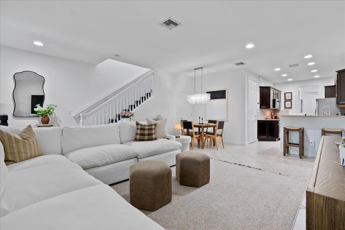 Located in Mallory Creek in Abacoa, this Key West-style townhome offers a prime Jupiter location minutes from Downtown Abacoa, Jupiter beaches, and top-rated schools. Mallory Creek is a walkable, tree-lined community that has resort-style amenities and a welcoming neighborhood feel. This 3 bedroom, 2.5 bath, 2-story unit offers an open, functional layout. Upstairs, the split-bedroom design includes a spacious primary suite with walk-in closet, en-suite bath, and private balcony, plus a secondary bedroom with its own balcony. Features include impact glass, newer appliances, newer A/C, and an attached one-car garage. Community amenities include two pools, clubhouse, fitness center, playgrounds, and walking paths. Easy access to I-95, the Turnpike, dining, shopping, and golf.