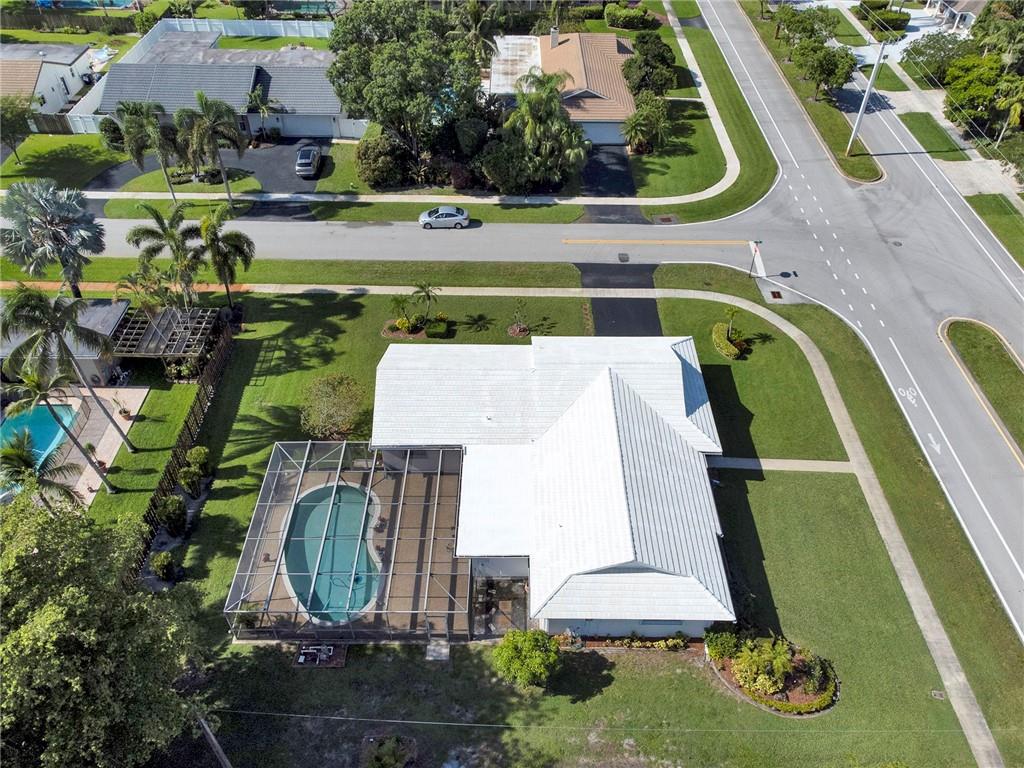 LEADING YOU HOME to a well cared for FIXER UPPER secured gated lifestyle nestled in the prestige of meticulously maintained Eldorado Estates. No high HOA fees here! Own this 15,466 sqft corner lot hosting spacious living areas in this 4 bdrms /2 full baths & 2 car garage, screened POOL home with desirable split floor plan of over 2700+ square feet that boasts pride of ownership and much of it's original charm; primed for your personal touches. NEW AC! newer water heater. Large master bedroom has a walk-in closet and sitting vanity. Other bedrooms view the pool. Home invite lots of natural light. Wet bar in Florida room. Enjoy tennis, playground, and events for residents. Clubhouse is available to homeowners. Property is in need of MANY upgrades and possibly a  new roof.  This is home!