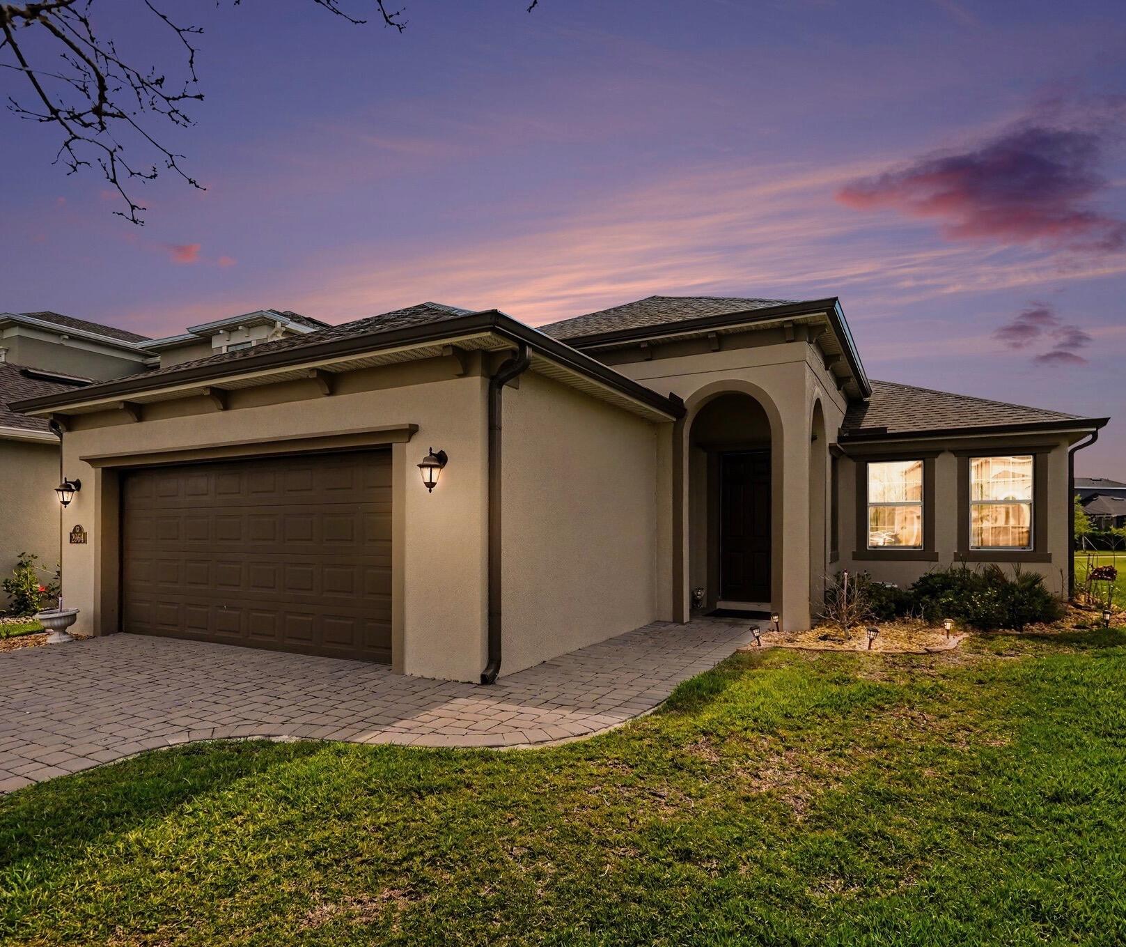 Welcome home! This beautiful single family home was built in 2023 by Viera Builders, this beautifully designed 3 bedroom, 2 bathroom home with a spacious 2-car garage offers 1,581 square feet of modern living space with an open-concept layout and stylish finishes throughout. From the moment you arrive, the home impresses with its attractive curb appeal featuring a paver driveway and professionally landscaped front yard. Inside, the bright and airy floor plan showcases neutral tones, wood-look tile flooring, and seamless flow between the living, dining, and kitchen areas. The spacious living room is perfect for relaxing or entertaining and features a custom entertainment wall. The dining area is filled with natural light and opens effortlessly into the chef-inspired kitchen complete with white shaker cabinetry, granite countertops, subway tile backsplash, stainless steel appliances, a large center island with seating, and sliding glass doors leading to the backyard.  The private primary suite offers a spacious retreat with a luxurious en-suite bathroom featuring dual vanities with granite countertops, a large walk-in glass shower, and generous storage space. 2 additional bedrooms provide flexibility for guests or a home office and are complemented by a beautifully finished 2nd full bathroom.  Additional highlights include a dedicated laundry room with full-size washer and dryer, recessed lighting, modern fixtures, and abundant natural light throughout the home.  Step outside to enjoy the covered patio offering the perfect setting for outdoor dining, pets, or future pool plans.  Sierra Cove is one of the premier single-family home communities located within the highly sought-after Addison Village area of Viera in Melbourne, Florida. One of the biggest attractions of Sierra Cove is access to the exclusive Addison Village Club, a resort-style amenity center offering multiple pools, tennis courts, pickleball courts, basketball courts, playgrounds, fitness facilities, event lawns, walking trails, and social gathering areas. The community was designed to encourage an active lifestyle while creating a strong sense of neighborhood connection and community involvement.  Sierra Cove's location in the heart of Viera makes it especially desirable. Residents are just minutes from The Avenue Viera, one of Brevard County's top shopping and dining destinations featuring restaurants, boutiques, entertainment, and nightlife. The community is also conveniently located near Duran Golf Club, top-rated schools, parks, medical facilities, and major employers connected to Florida's growing Space Coast economy.  Outdoor enthusiasts appreciate the close proximity to beautiful beaches, boating, fishing, golf courses, and nature preserves, while commuters benefit from quick access to I-95 and nearby Orlando attractions and airports. Sierra Cove combines luxury living, resort-style amenities, excellent schools, and a prime location, making it one of the most desirable communities in the Melbourne and Viera area.
