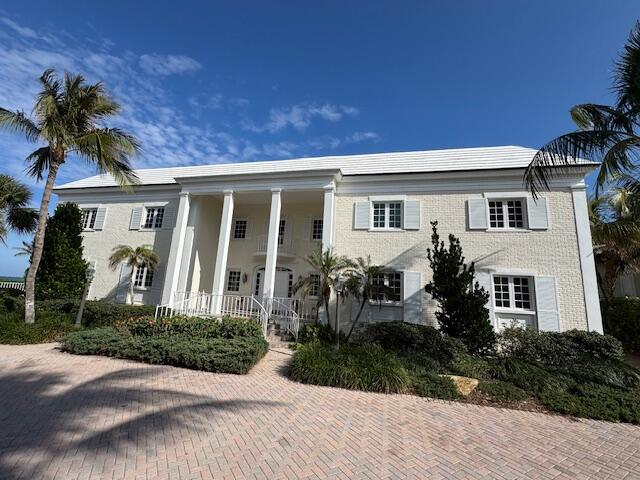 Located in Exclusive Lost Tree Village with spectacular direct oceanfront views. This 3 bedroom and 3 bath condominium includes direct access to the beach with steps down to the ocean. Wrap around ocean views from the greatroom, dining room, kitchen and loggia. Complete ground-up rebuild of the structure (according to code) including hurricane impact glass all around in 2006. Elevator access to the front door from the two designated underground garage parking spaces. The building consists of only 4 condominiums each with their own private storage area. There is a private pool directly on the ocean for use of the 4 condominiums and a duplex down in front. The Beach Club is within walking distance. New roof and elevator.