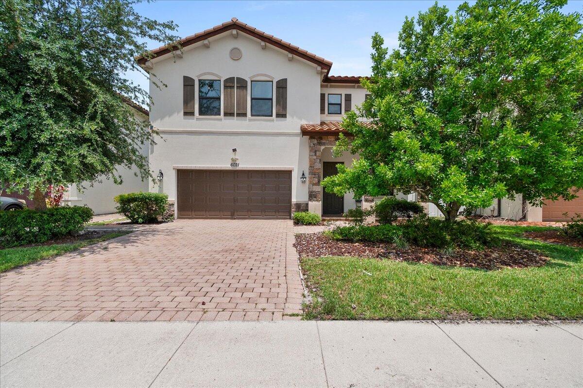 Fully Furnished!! Experience upscale lakefront living in this beautifully  4-bedroom, 2.5-bath home offering 2,327 sq. ft. of bright, modern living space. The open-concept floor plan features a spacious living and dining area, a stylish kitchen with granite countertops, stainless steel appliances, a large center island, and plenty of cabinet space. Upstairs, you'll find generously sized bedrooms, including a luxurious primary suite with serene water views. Enjoy relaxing or entertaining on the oversized paver patio overlooking the peaceful lake and fountain. Conveniently located near shopping, dining, parks, major highways, and top-rated schools.