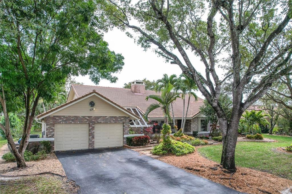 Rarely available, nestled in the exclusive neighborhood of Glen Isles (estates section of Cypress Glen), this beautiful home sits on an oversized, waterfront lot! Outstanding upgrades and features include: open floor plan with vaulted ceilings; gorgeous, double-sided fireplace in living room & family room; eat-in kitchen with center island open to the family room; large bedrooms (closet can be added to office/4th bedroom); beautiful master suite with spa-like bathroom (wood ceilings, skylights, etc.); walk-in closets; accordion hurricane shutters; cabana bathroom opens to the large, covered patio; screen-enclosed, oversized pool and absolutely stunning water views! This home exudes charm and is unlike any other you'll see! No HOA! Conveniently located near shopping, dining and more!