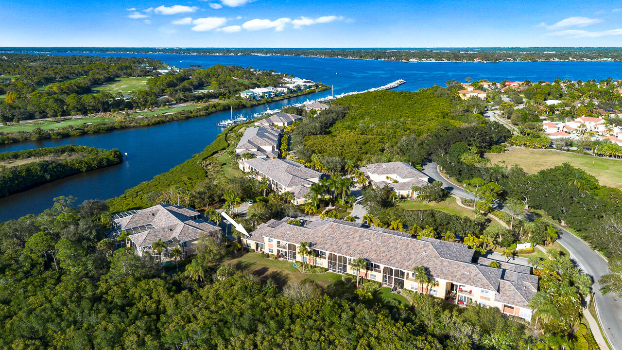 This Pristine corner townhome in Harbour Island at Palm Cove Golf & Yacht Club is located on a very private cul-de-sac w/views of the river just steps away! The large great room opens to a beautifully remodeled kitchen w/custom cabinetry, wine fridge & calming preserve views, making it perfect for entertaining. Features include new roof, custom window treatments, 12 ft. ceilings, and a spacious primary bath w/soaking tub & renovated shower.  This 2-bed, 2-bath home has a den that easily converts to a 3rd bedroom & a 2-car garage with plenty of storage.  HOA includes security, lawn care, BlueStream internet & fiber-optic cable, a riverfront clubhouse, heated pool, fitness, playground, tennis & many planned social events, a private 18-hole golf course & a 93-slip marina w/ocean access.  Close to Martin County's 'A' schools, parks, marinas, world-class fishing, shopping, dining & live theater in award-winning Downtown Stuart, I-95, the FL Turnpike, and sparkling Hutchinson Island beaches!