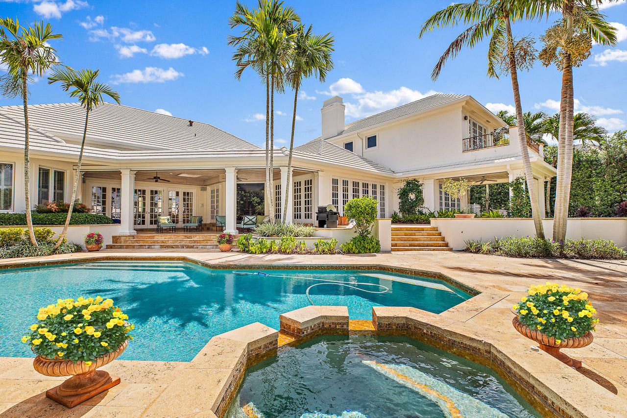 Stunning Estate home on 110 feet of Water Frontage. Situated on the desirable Commodore Island, close to the clubhouse and minutes to the Intracoastal waterways. This spacious single story main house features 4 bedrooms, an office, formal living and dining room, gourmet kitchen and a great room. The Guest apartment has 2 guest rooms with private baths as well as a full kitchen and family room. generator, impact windows, 4 car garage. This home is a welcoming retreat.