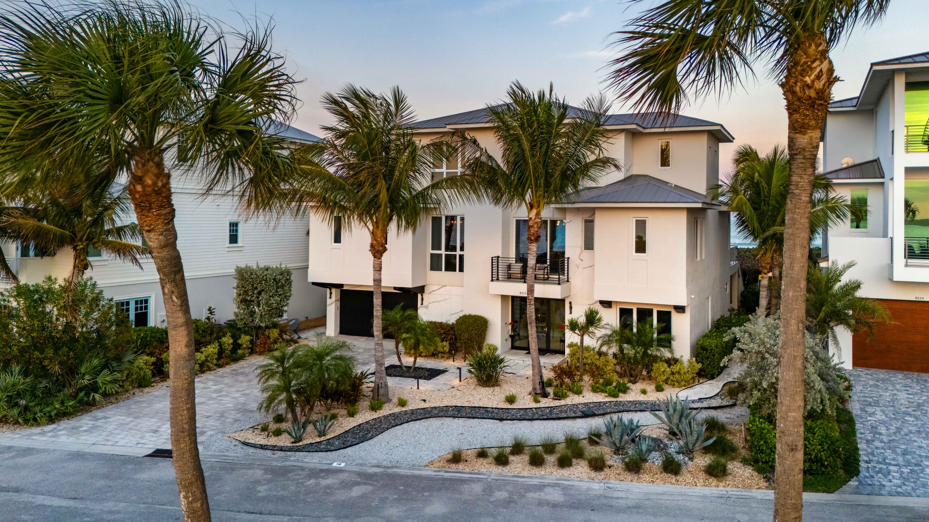 SALE PRICE REFLECTS NETSALE - Where the Atlantic meets the Intracoastal, this 2020-built coastal estate captures the rare privilege of true dual-waterfront living. Designed for sunrise over the ocean and sunset across the river, nearly every room frames sweeping water views. Close to 5,000 square feet of refined interiors blend architectural clarity with effortless flow. Bespoke RH finishes, a chef's kitchen with Sub-Zero and Wolf appliances, and spa-inspired en-suites create a private resort atmosphere. Quartz surfaces, porcelain details, and rich dark maple accents add warmth to contemporary design. Expansive glass walls dissolve the line between indoors and sea and sky. A six-car garage and private community dock accommodating vessels up to 50 feet