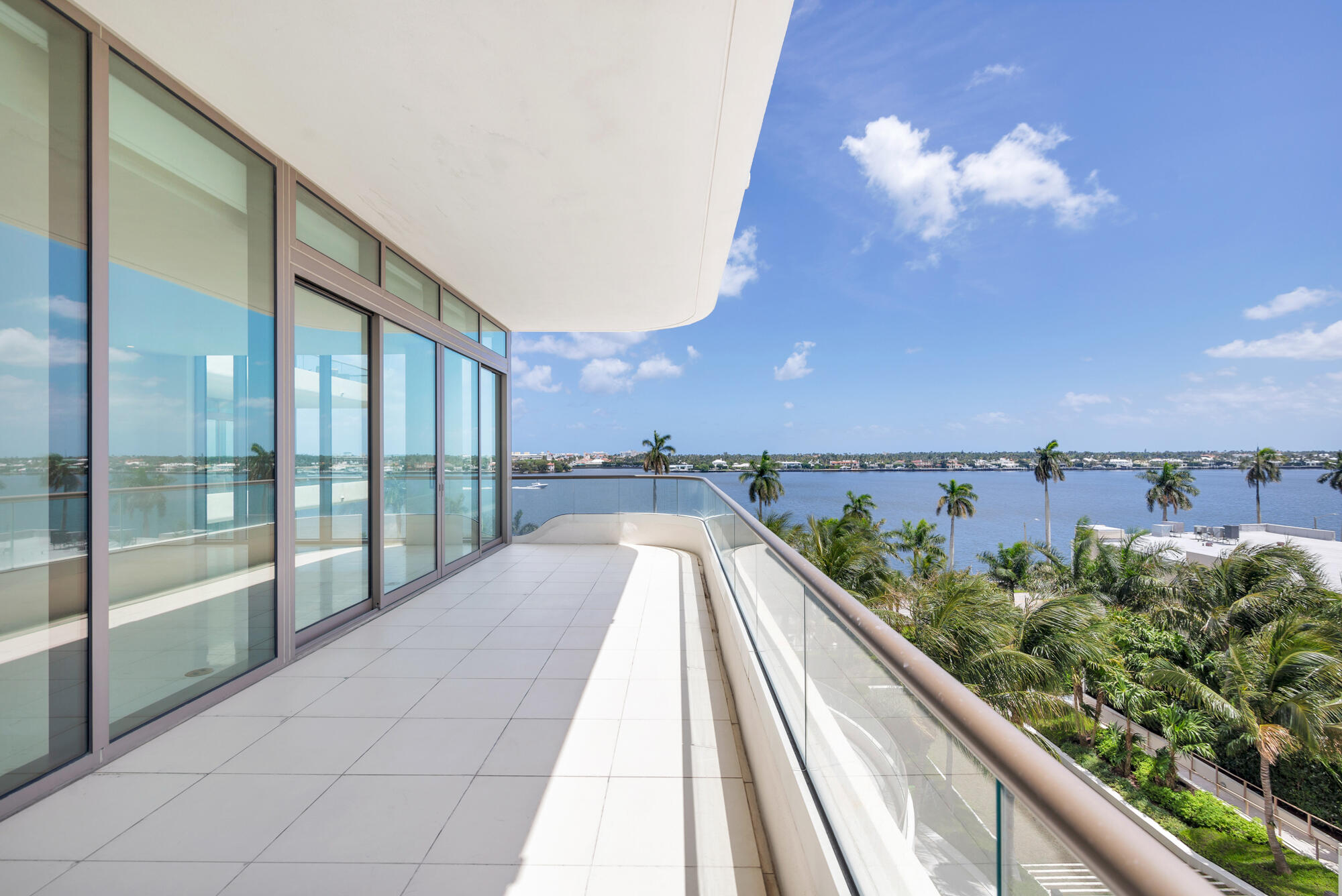 Residence 504 at La Clara presents an exceptional opportunity to own in one of West Palm Beach's most sought-after waterfront buildings. Completed in 2024, this boutique 25-story tower comprises just 83 homes, creating an intimate setting defined by privacy, exclusivity, and refined design. Positioned on the desirable D-line, Residence 504 spans 2,577 total square feet with 2 bedrooms plus a den and 2.1 bathrooms. Expansive living spaces are filled with natural light and capture unobstructed Intracoastal views, with floor-to-ceiling glass and oversized sliding doors opening to a generous private terrace for seamless indoor-outdoor living. The interiors are thoughtfully finished with large-format limestone flooring throughout the main living areas and a fully integrated smart home system. The custom Italian Snaidero kitchen is equipped with Miele appliances, a gas range, and integrated paneling, complemented by upgraded countertops and backsplash selections. Additional highlights include custom window treatments, custom designed walk-in closets, two parking spaces, and two private storage units. La Clara features a curated collection of amenities, including a lap pool and daybeds, fitness and yoga studios, private dining and entertaining spaces, and manicured gardens, all set against sweeping views of the Intracoastal and Palm Beach Island.