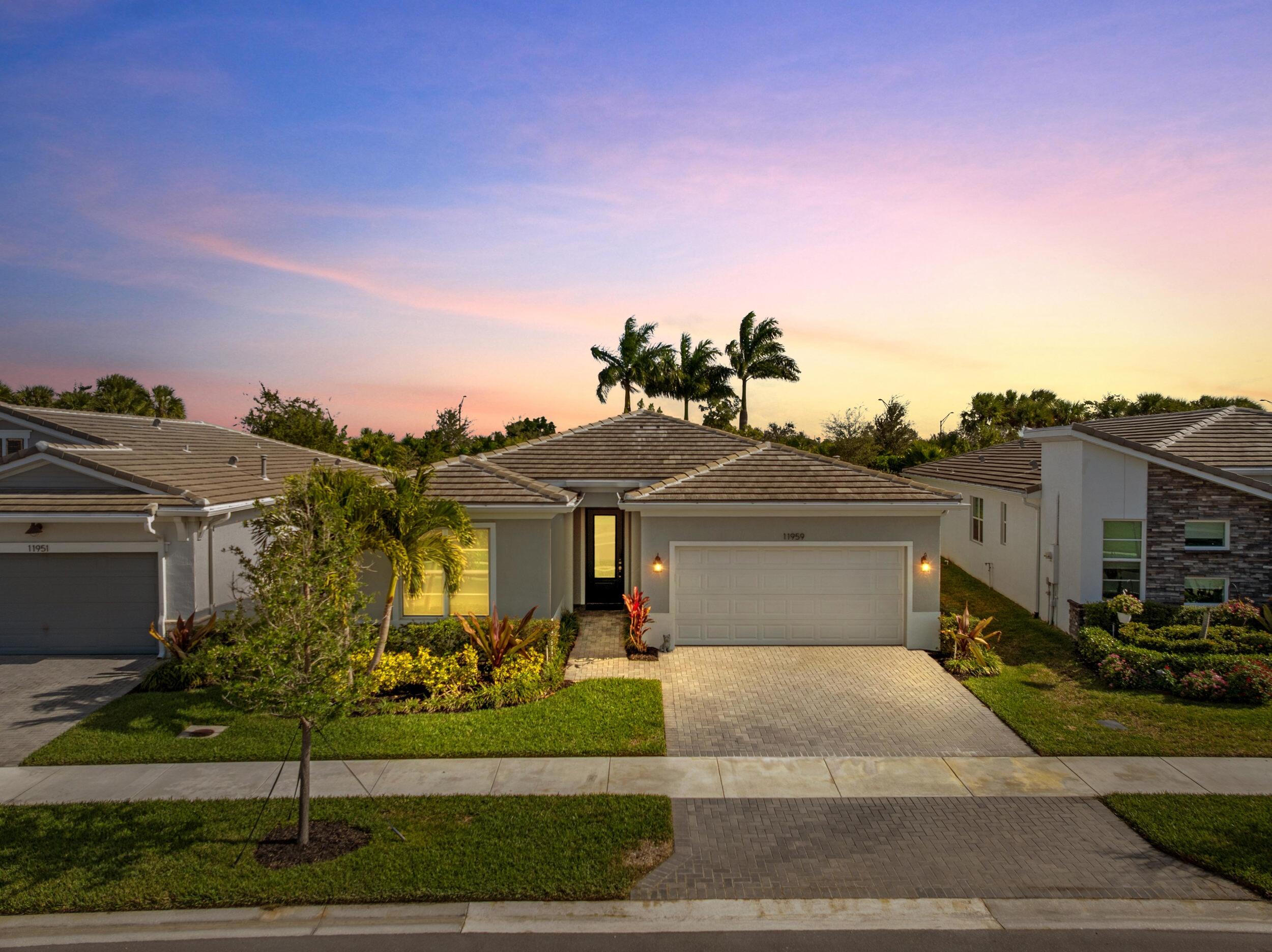 Rarely available Haven model with 2 Bedrooms, a Den and 2.5 Bathrooms with over 100K in options! Upgrades include: a gourmet kitchen package with a 36'' cooktop and hood, upgraded appliances, custom backsplash, an extended screened in lanai, glass french doors to the flex room, a passthrough from the master bedroom to the laundry room for added convenience, additional LED lighting, wood look tile flooring and custom closet built ins in the master bedroom. Full impact windows and sliders. Private backyard.  Open concept living, dining and kitchen area flows nicely for entertaining. Oversized kitchen island and large walk in pantry is every cook and entertainer's dream. Extended screened in lanai is shaded throughout most of the day, offers a relaxing outdoor space to enjoy the Florida scenery and privacy with no rear neighbors. Master suite is spacious with a generous sized en-suite bathroom. Guest bedroom is tucked away at the front of the home and is right next to a full bathroom, offering the ideal layout for guests to have their own space. Flex room with beautiful glass French doors would make for a great hobby room, office or den. An extra half bathroom and built in storage area are some of the touches that make this home stand out. Brick paver driveway, walkway and lanai. 2 car garage. Telaro just completed a magnificent 20,000 square foot clubhouse. Inside you have access to a grand hall, lounge area, demonstration kitchen, card room, wine room, craft room, saunas and massage room. Outside you will find plenty of shaded seating areas, resort style pools, a zen garden, basketball, bocce ball, pickelball, and tennis courts. Vibrant community with a robust calendar of events including wine club, cooking club, poker club, tennis club, book club, yoga club and more. Come experience a resort lifestyle. Conveinently located in the heart of Tradition. Walk, take your golf cart or the free TIM shuttle to local shops and restaurants. Located right near the Heart at the Park, the latest Port Saint Lucie attraction and restaurants like Kyle G's Amore Italian Chophouse, Sara's Kitchen and Robeks Juice. Minutes from The Fresh Market, Target, Publix and shopping at the Landing at Tradition. Tradition Town Center is home to a Sunday farmer's market and a variety of community events. Conveniently located near I-95 and easily accessible to Palm Beach International Airport and Vero Beach Airport.
