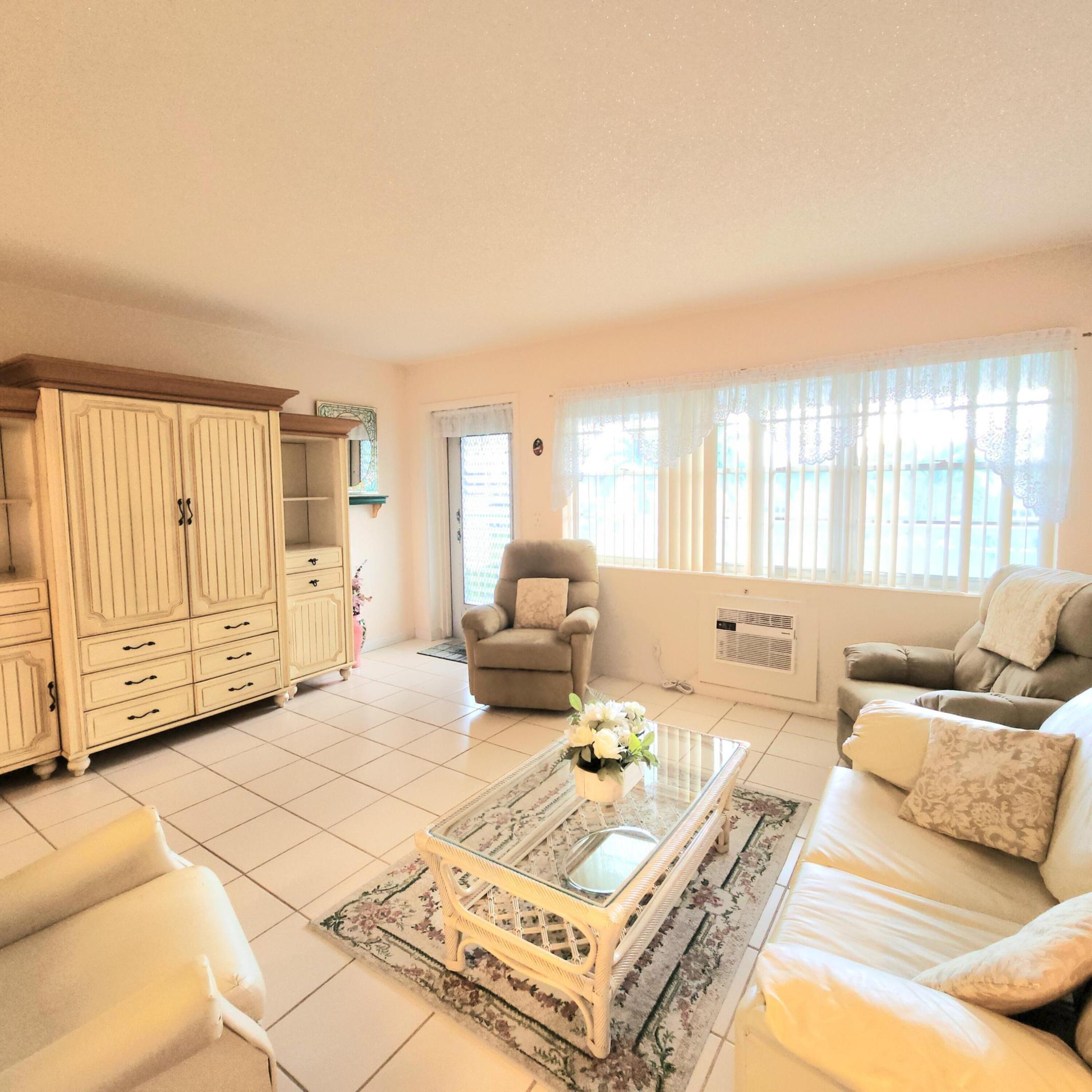 Great value for this sparkling professional cleaned condo. Walk in the front door to a bright and cheery living room then to your spacious dining area, off to the side is your spotless kitchen with plenty of prep space. The unit is equipped with utensils, plates and glasses. Just bring your personal belongings. The hallway has a walk in closet/pantry. Large comfy bedroom with walls of closets. Tile throughout, the stylish furniture as pictured is included in the price. Has a closed in Lanai to relax and a desk area for computer, crafts or whatever you like. This condo has no assessment, nicely maintained building which features pretty shutters on all the windows. There is a wonderful patio area with plenty of places to sit, umbrellas if you do not want the sun, and fancy Light post for after hours. Century Village is a 55 and over community with plenty of activities for all to enjoy. Just to name a few: Clubhouse Amenities: -Shuffleboard -Bocci Ball -1200 seat theater for shows and movies. -Numerous clubs to join, to include trips in the US and Europe -Hasting's elite fitness center with complete, heated pool, the Lazy River resistance pool chair yoga, pool aerobics plus much more. -Sailing on the lakes of Century Village, don't know how to sail, no worries they have lessons. -Tennis/Pickleball -Indoor saltwater swimming pool, plus 8 swimming pools to choose from throughout the community -Duck Island with pier: picnics, barbeques, gatherings or just relaxation. -Community bus to transport you inside the village and outside the village for shopping, dining and much more. hair salon and barber and manicure pedicure. -Library -Dance/Party room -Pool table and ping pong room -And so much more Call me today for your private showing!