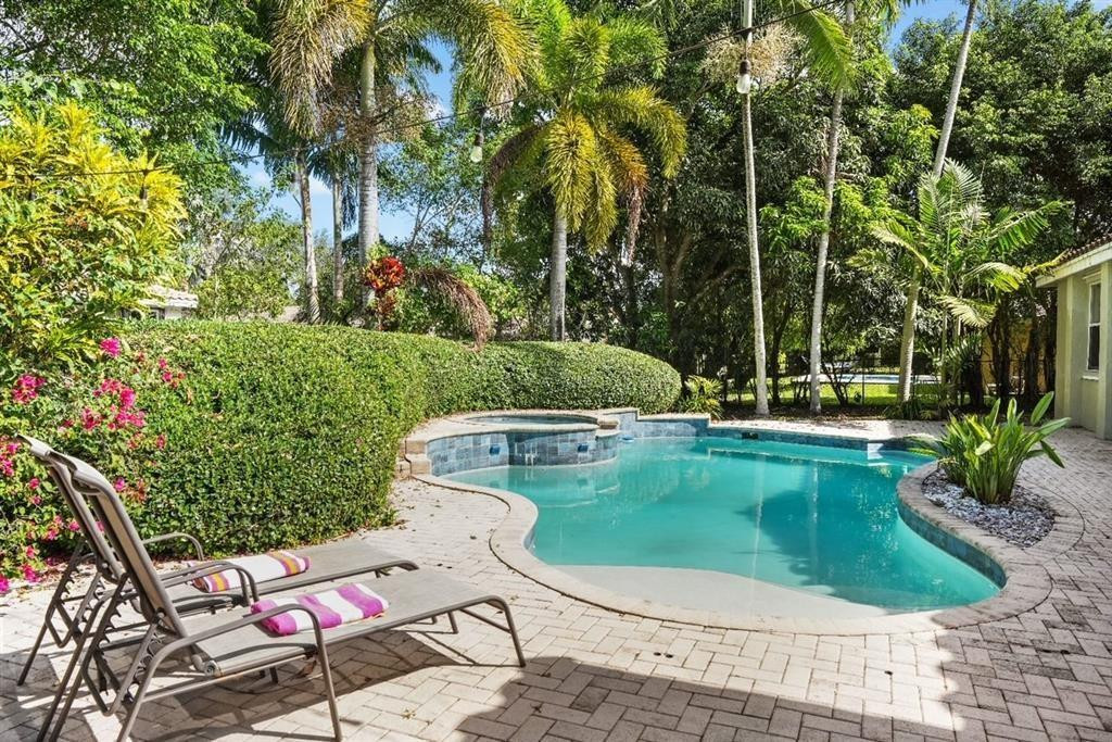 APPROVED SHORT SALE Beautiful pool home located in the gated Groves at Old Cutler, set on a generous 15,000 sq ft lot with vaulted ceilings, lush landscaping, and six mango trees. Split floor plan with a private primary suite featuring walk-in closets, plus 4 bedrooms, 2 full baths, and 1 half bath. Two-car garage. Quiet community with low quarterly HOA.Prime Palmetto Bay location near top-rated public schools, Palmer Trinity, Westminster, Old Cutler bike path, and Deering Estate.