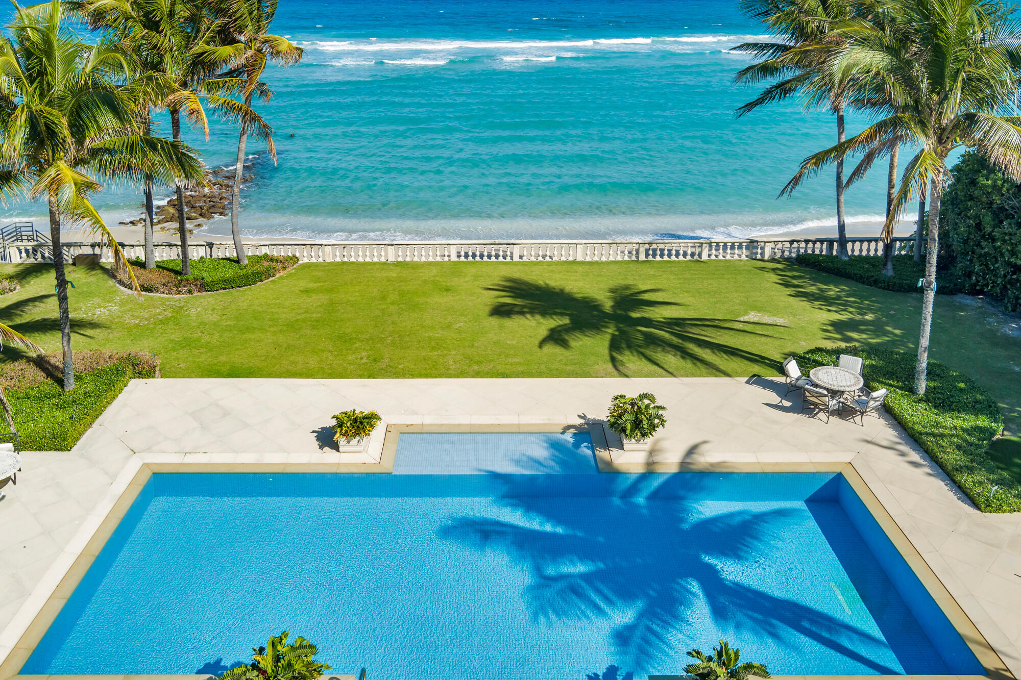 Magnificent direct oceanfront Palm Beach estate boasting 125 feet of pristine beach frontage. This 6-bedroom, 7 full and 2 half bath residence is located near town on a quiet cul-de-sac, offering remarkable privacy and tranquility. A breathtaking backyard unfolds along the Atlantic, complete with an expansive outdoor loggia, beachside pool, cabana, and separate staff quarters. Experience the very best of seaside living from this quintessential Palm Beach retreat.