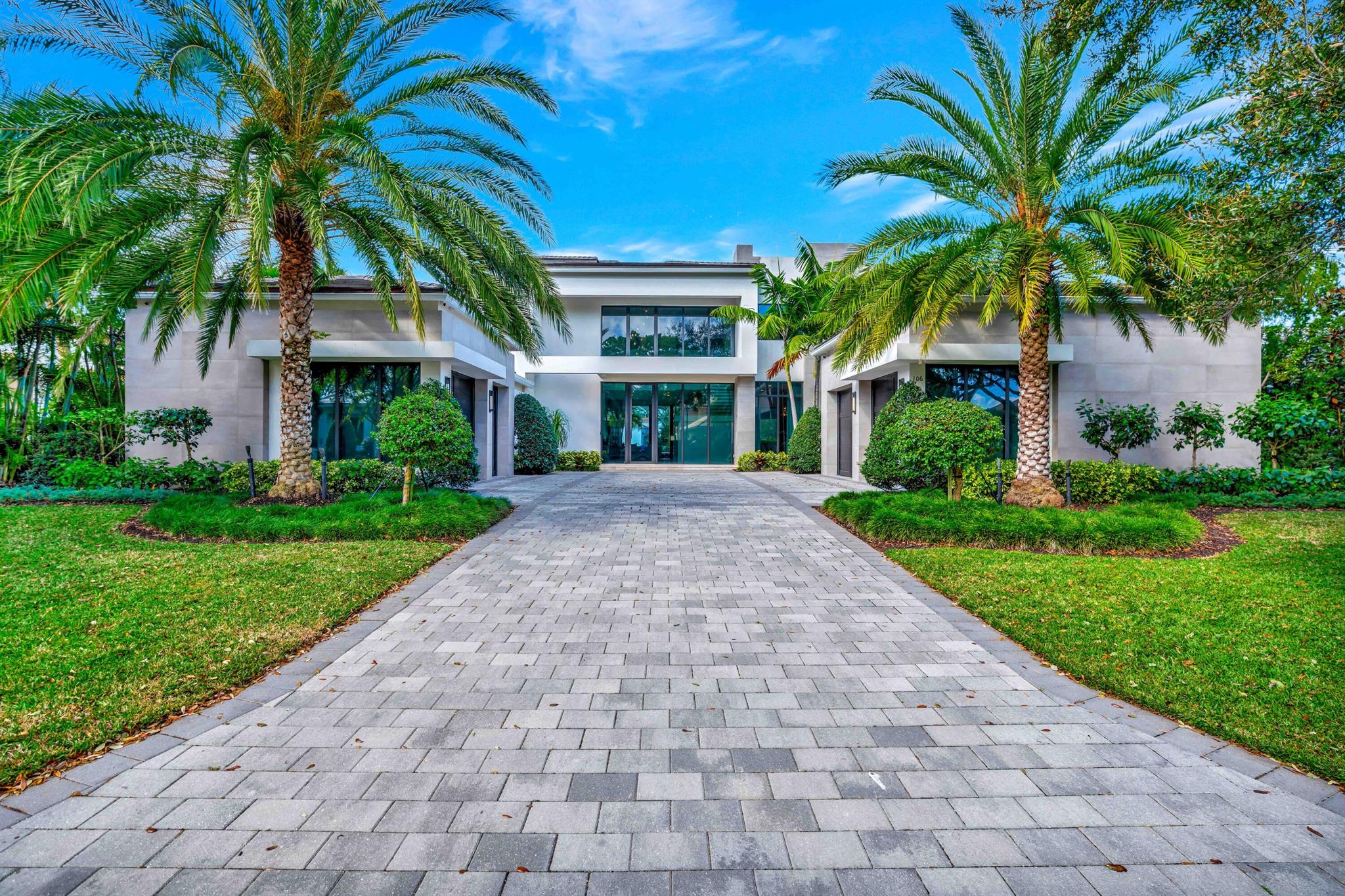 This is the custom home of your dreams—ready for you now! This sophisticated, fully furnished contemporary waterfront estate, built in 2020, is move-in ready. Step into the grand foyer and be captivated by a stunning wood and glass floating staircase, natural stone flooring throughout the main living areas, and a striking see-through wood-veneered gas fireplace perfectly positioned between the formal living and family rooms. Impeccable ceiling details and a dramatic wall of glass along the back of the home seamlessly blend indoor and outdoor living. Enjoy the convenience of Crestron lighting throughout. The chef's kitchen is a masterpiece, featuring precision-mitered porcelain countertops, Sub-Zero and Wolf appliances, fine milled cabinetry, designer plumbing fixtures, and... a butler's pantry equipped with two 6' EuroCave wine coolers. Retreat to the oversized primary suite, where breathtaking water and pool views, abundant natural light, and his-and-hers baths and closets create a true sanctuary. Her bath boasts elegant white marble floors, a free-standing contemporary tub, a frameless glass shower, a beautiful quartz vanity, custom cabinetry, and a refined dressing area. Upstairs, an oversized loft, elevator, and three spacious guest bedroomseach with ensuite baths, walk-in closets, and large balconiesoffer unparalleled comfort and spectacular water views. With 110 feet of waterfront, this property accommodates an 80' yacht, with no fixed bridges to the ocean. The outdoor oasis includes a custom heated pool and spa with automated controls, waterfalls, and a sun shelf. Enjoy alfresco entertaining in the well-appointed summer kitchen, multiple seating areas, phantom roll-down screens, and a mosquito misting system for added comfort. Additional features include a full-house generator, impact windows, outdoor security cameras, two safes, and an EV charging station for ultimate peace of mind. This extraordinary home is waiting for youexperience waterfront luxury at its finest!

Required golf membership purchase conveys all the first class amenities of Admirals Cove including two spectacular clubhouses, 45 holes of golf, 5 restaurants, 58 slip marina with floating docks, Yacht Club, 9 har tru tennis courts, 12 pickleball courts, state of the art fitness and wellness center with Technogym machines, 21,000 sq ft spa & salon, 30 room Waterside Private Boutique Hotel for members and their guests, brand new Golf Learning Center, Covesters kids club, dog park and Platinum service.