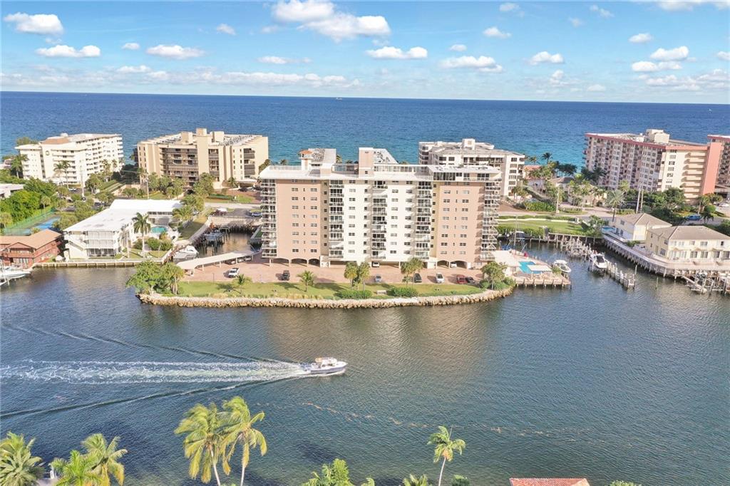 Move Right In! This Spectacular Furnished 2/2 Condo is Remodeled throughout!! Located at Hillsboro Island House on Hillsboro Mile that is truly on an Island! Spacious Open Floor Plan ,Gorgeous Kitchen, Waterfall Countertops, Stainless Appliances, Italian Porcelain Tile Flooring Throughout, New Bathrooms /Modern Fixtures, Updated Electrical and Lighting, Walk In Closets ,Impact Windows and Slider Doors. Best of Both World's with stunning Intracoastal Views from your large open-air glass balcony and Ocean views from your kitchen and bedroom windows. Island House offers it all ...Renovated Pool & Barbecue Area, Well Maintained Grounds, Gym, Newer Roof, Reserves, Ocean-Beach Access.  Low Maintenance Fee of $497/month. When Available, Renovated On-Site Boat Dockage up to 42 ft.